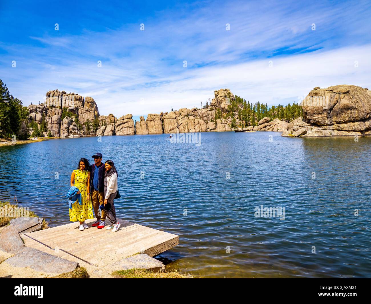 Family posing for picture at Sylvan Lake in Custer State Park in the Black Hills of South Dakota USA Stock Photo