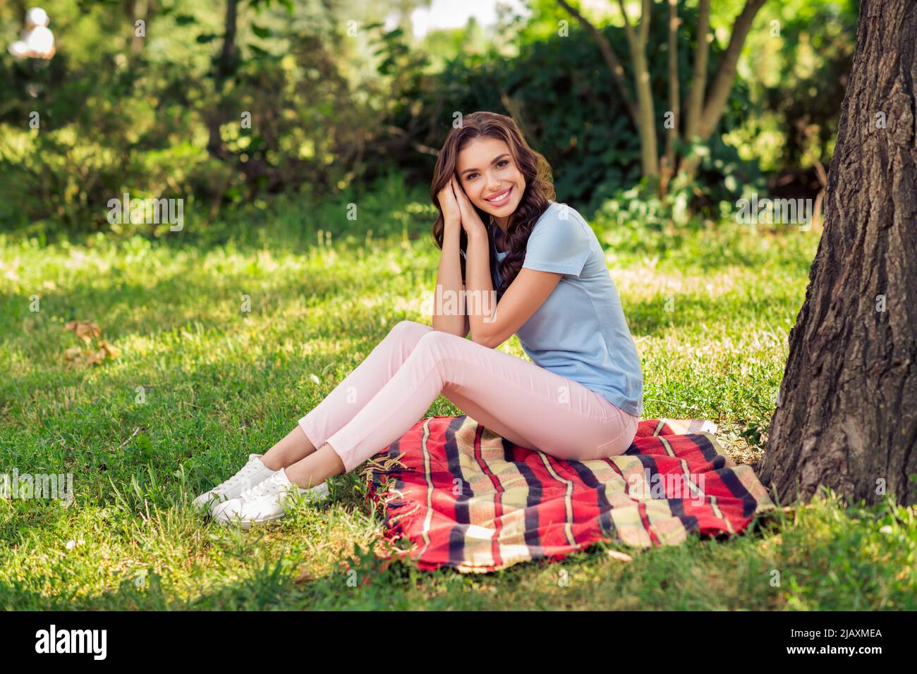 Full length body size photo woman sitting on blanket in park wearing ...