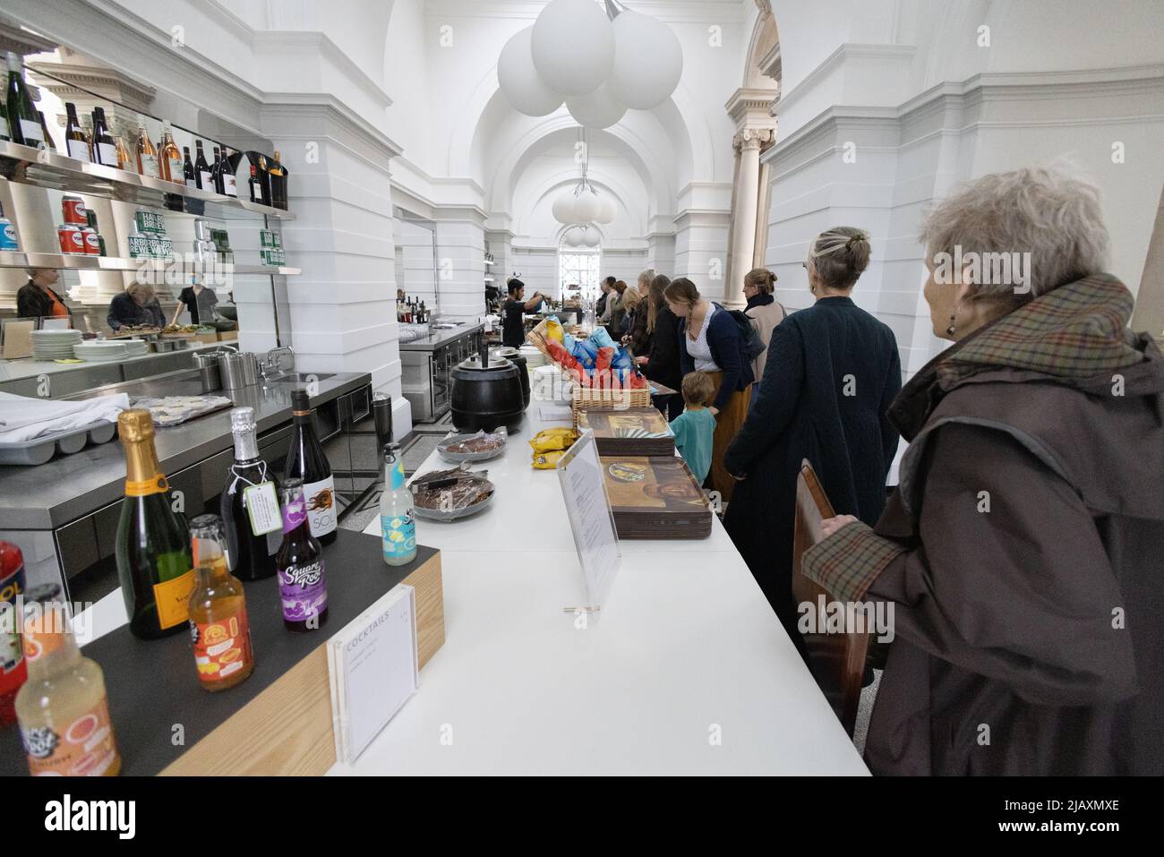 Tate Britain members restaurant interior; people at the counter waiting for food and drink, Tate Britain art gallery, Millbank, Pimlico London UK Stock Photo