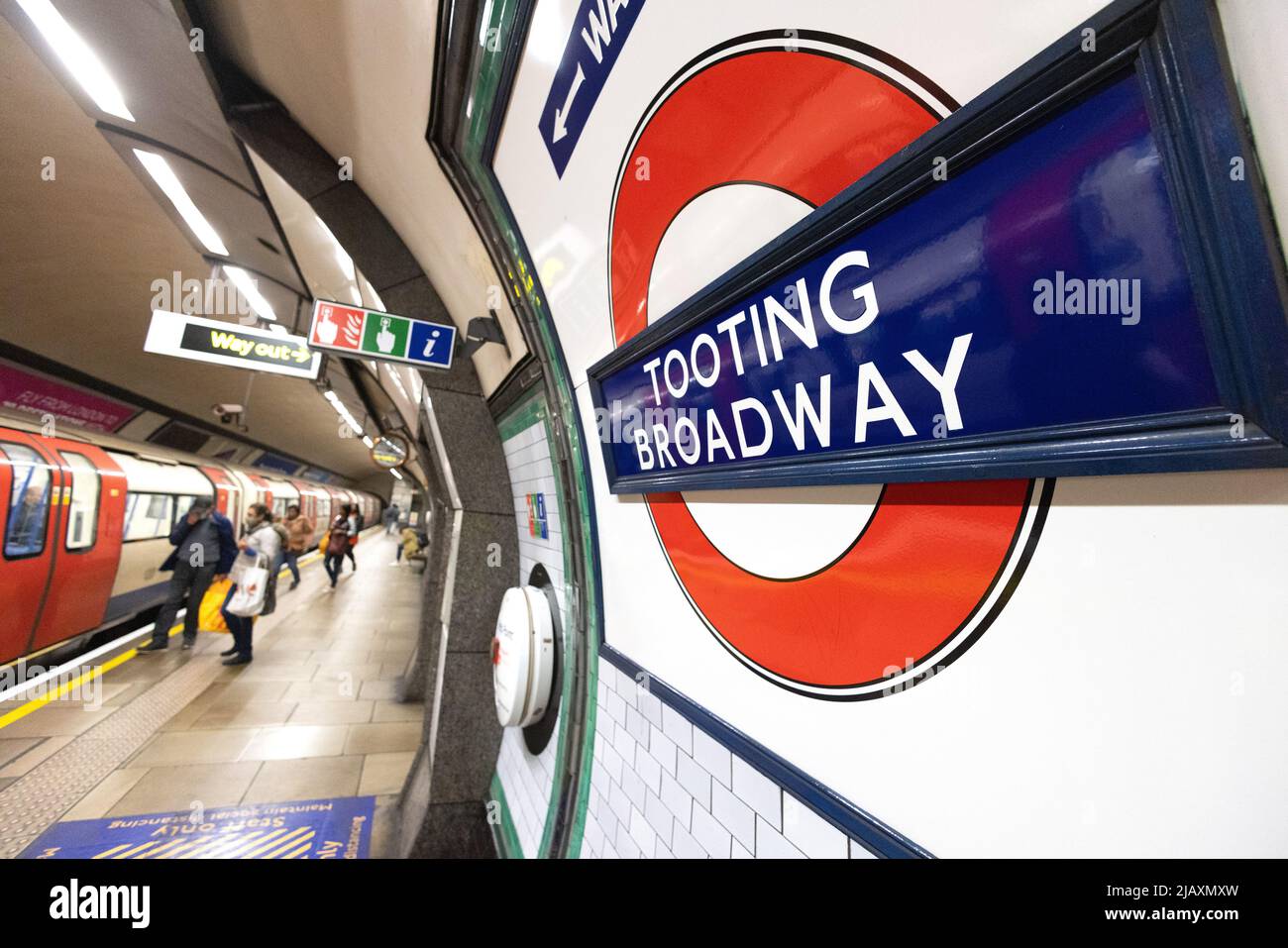 Tooting Broadway underground station interior, platform and roundel sign,  London tube stations, Tooting, London UK Stock Photo