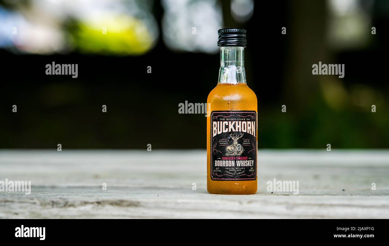 NORWALK,  CT, USA - MAY 29, 2022: Buckhorn Kentucky straight bourbon whiskey outside on table Stock Photo