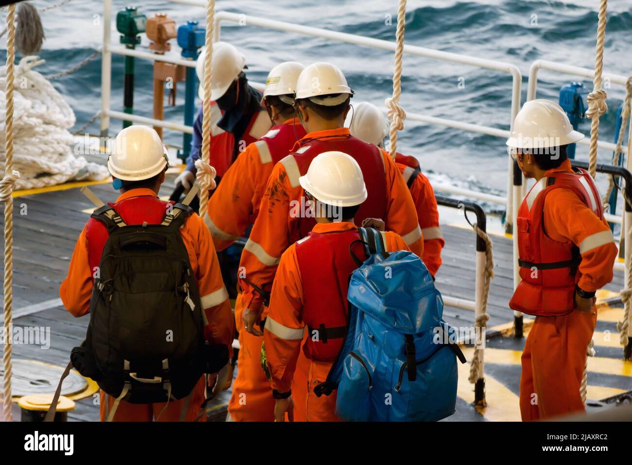 Rig workers are transported on a vessel to offshore rigs in The South China  Sea, Brunei. A swing rope is used to enter the platform Stock Photo - Alamy