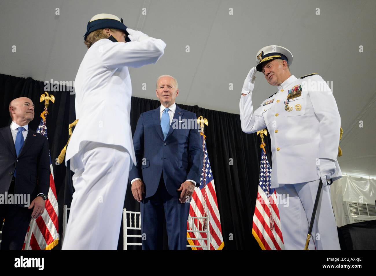 Washington, United States. 01st June, 2022. President Joe Biden and Homeland Security Secretary Alejandro Mayorkas (L) watch as outgoing Commandant Adm. Karl L. Schultz (R) salutes incoming Commandant Adm. Linda Fagan in a change of command ceremony at U.S. Coast Guard Headquarters in Washington, DC on Wednesday, June 1, 2022. Photo by Bonnie Cash/Pool/Sipa USA Credit: Sipa USA/Alamy Live News Stock Photo