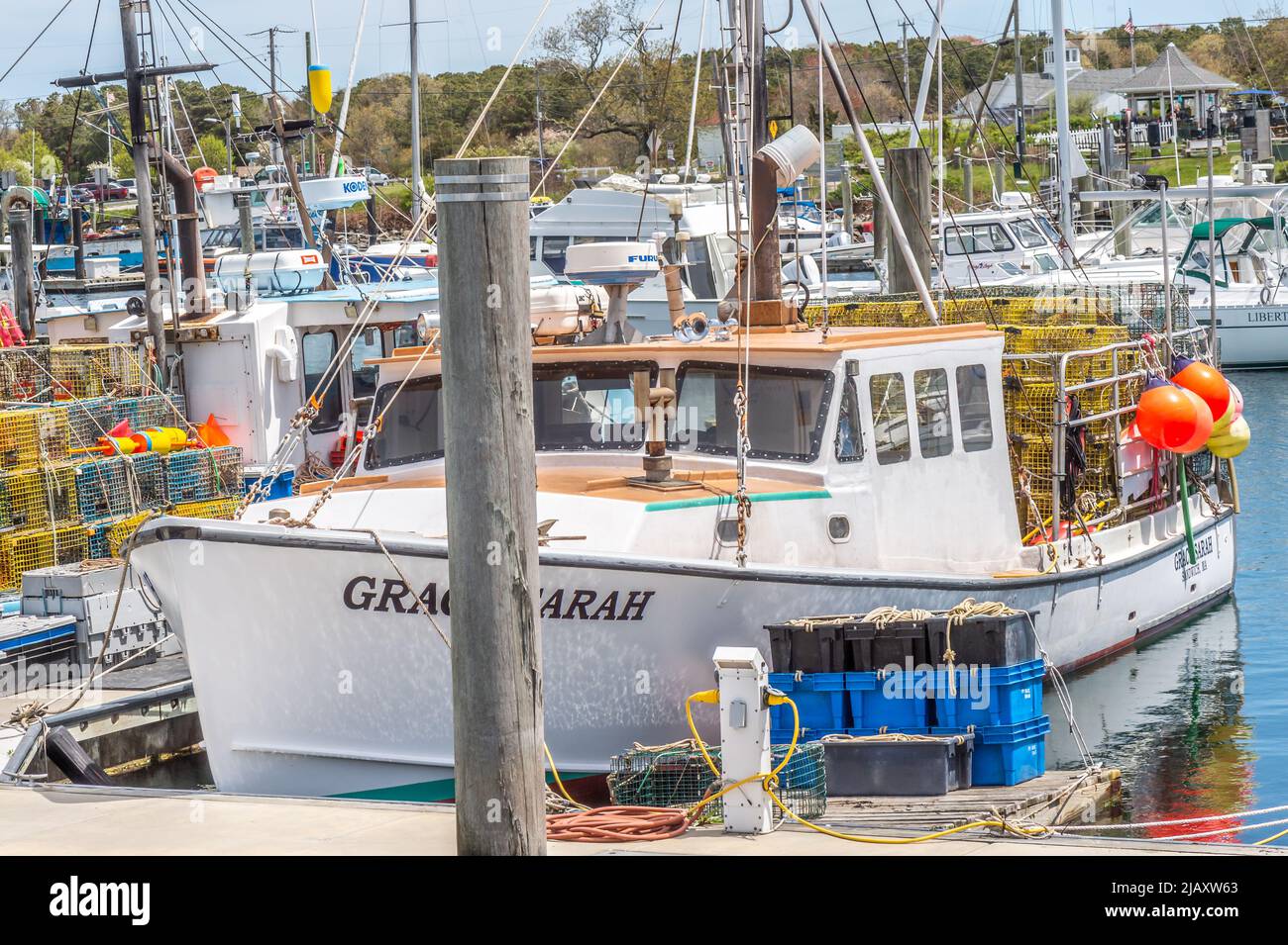 A sunny weekend in Spring. Fishing boats, an pleasure boats are all getting ready to go out in one way or another, for work or pleasure. your choice. Stock Photo