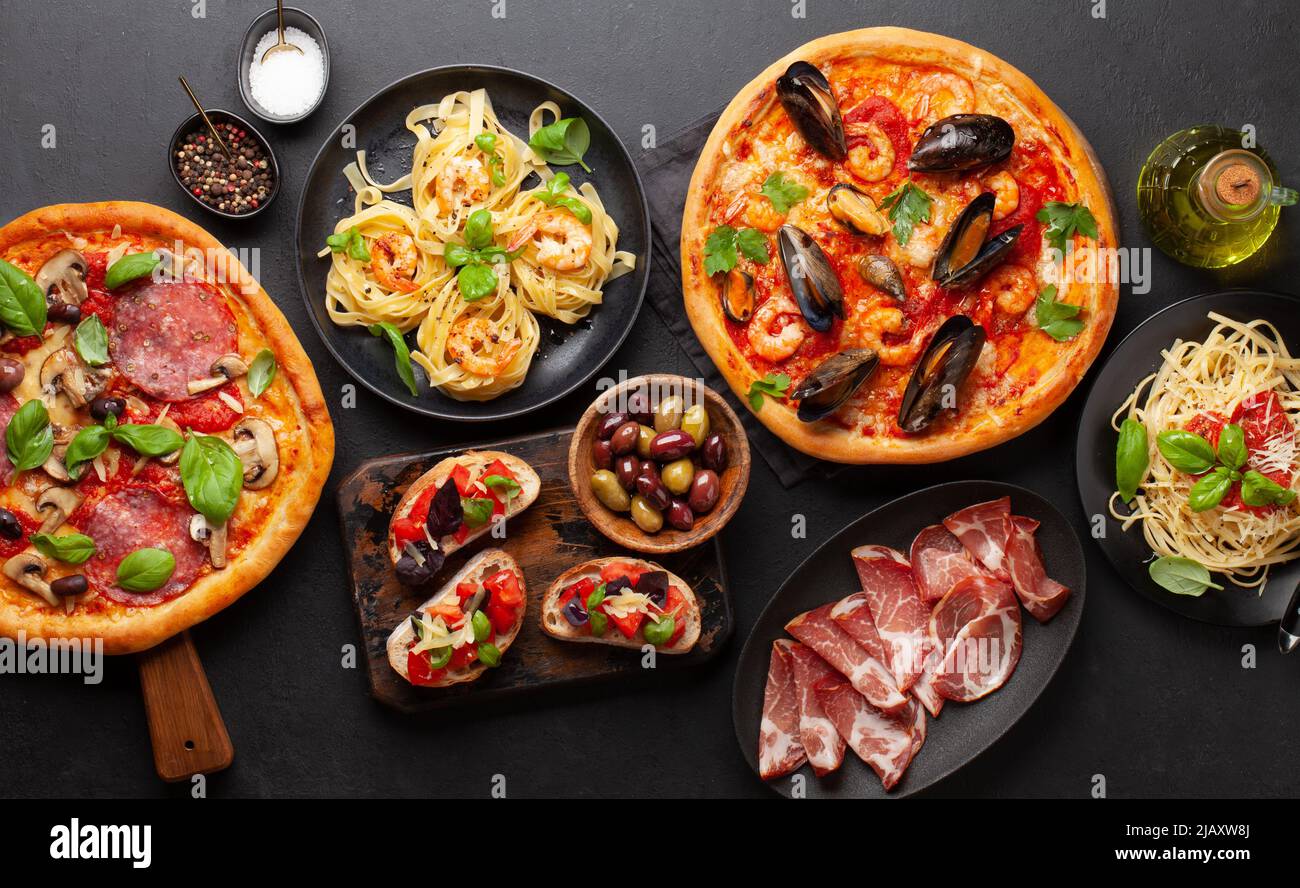 Italian cuisine. Pasta, pizza, olives and antipasto toasts. Flat lay
