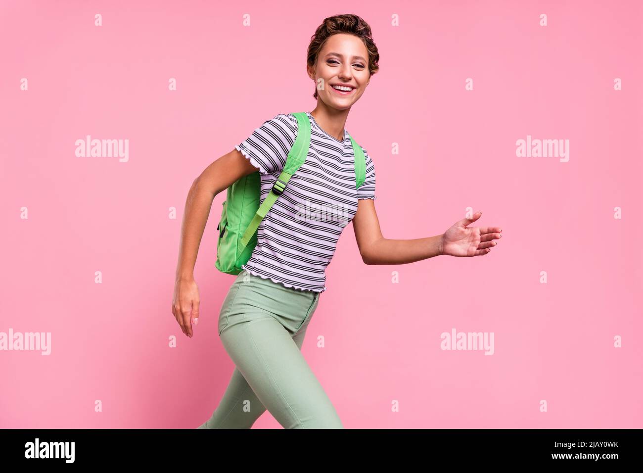 Profile photo of impressed millennial lady run wear bag white tshirt