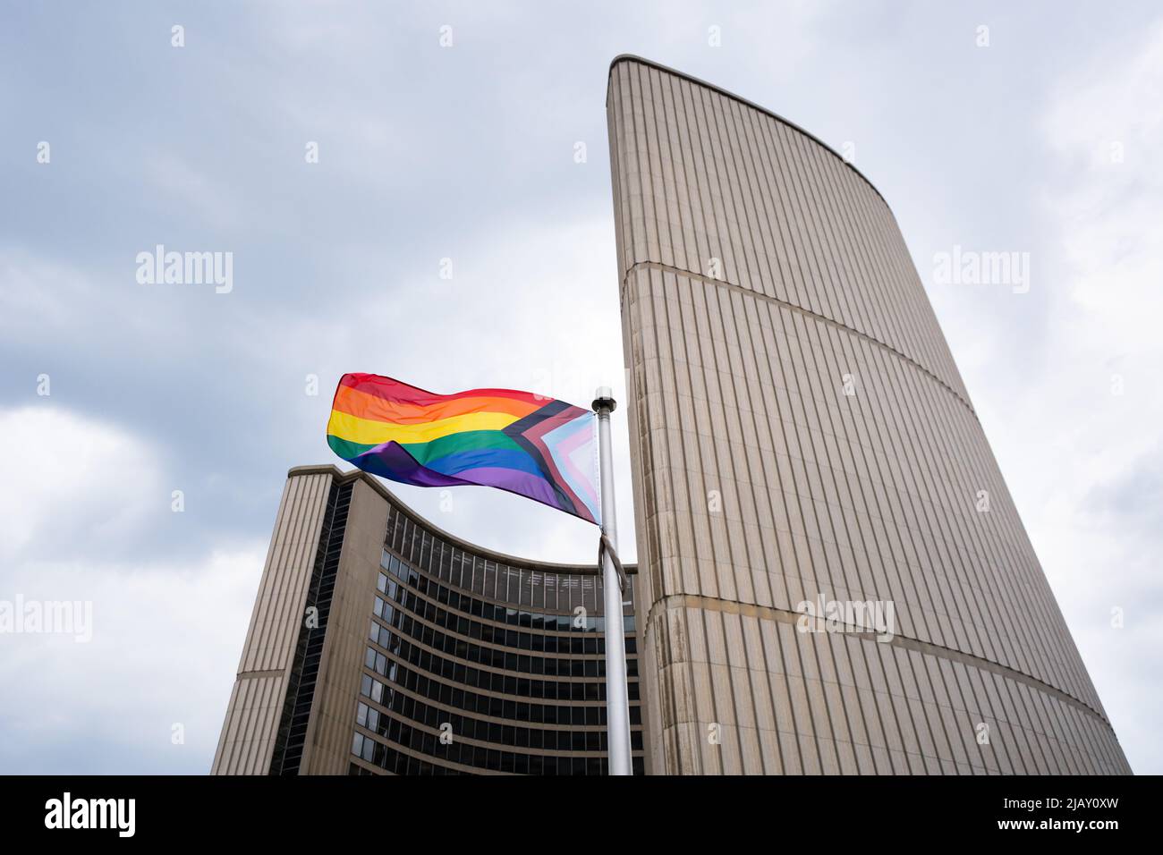 The 'Progress' Pride flag flies for the first time at Toronto's City Hall for Pride Month 2022. Stock Photo