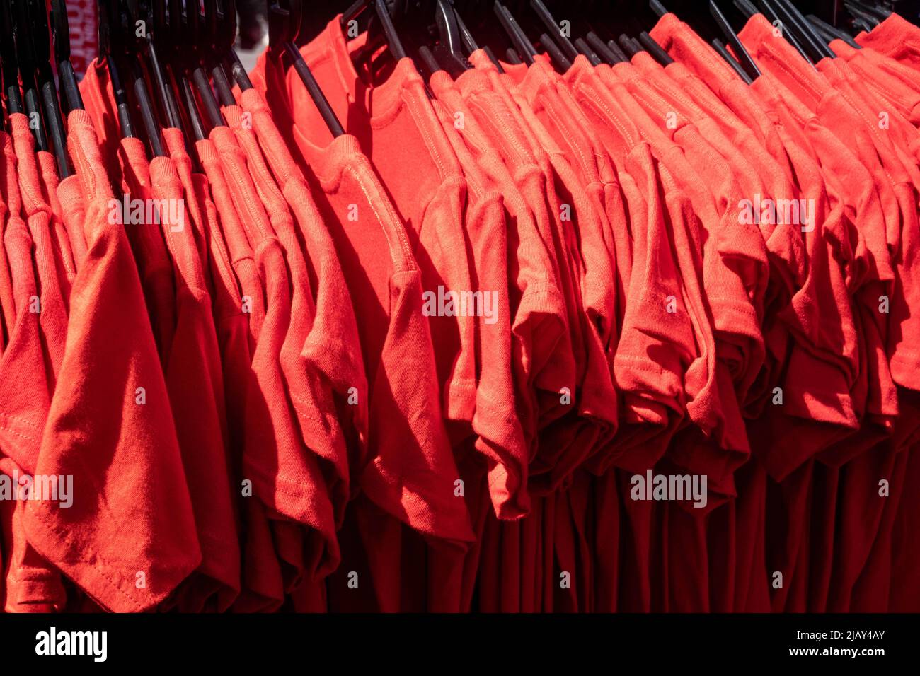 A line of red Liverpool Football Club tee shirts for children Stock Photo