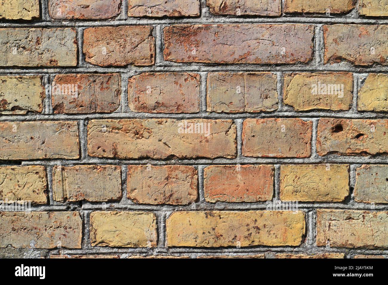 Old weathered brick stone wall background Stock Photo