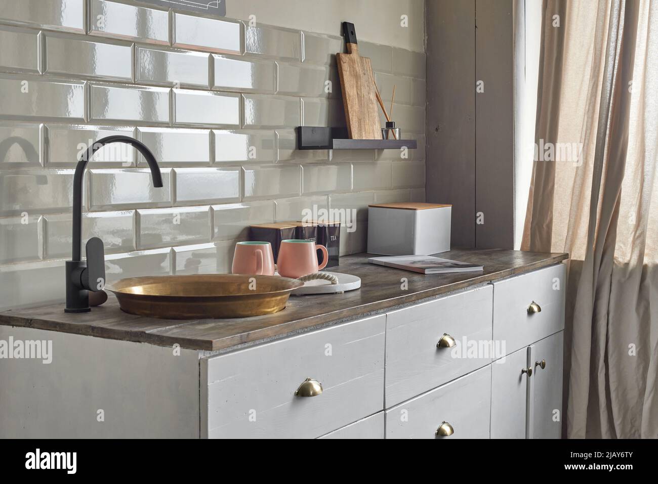 Comfortable elegant kitchen counter with sink at country house. Stock Photo