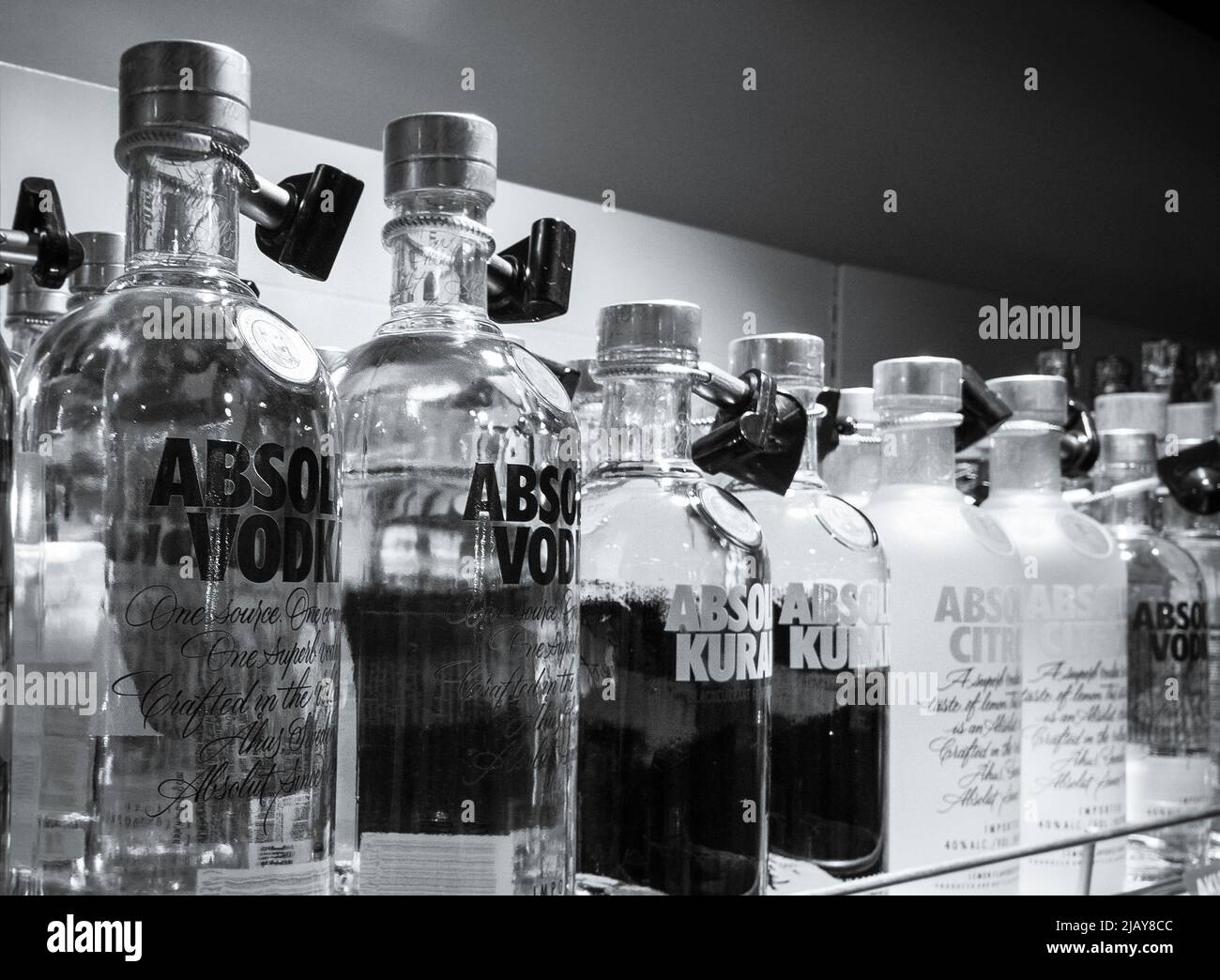 the Absolut vodka assortment stands on supermarket shelves Stock Photo