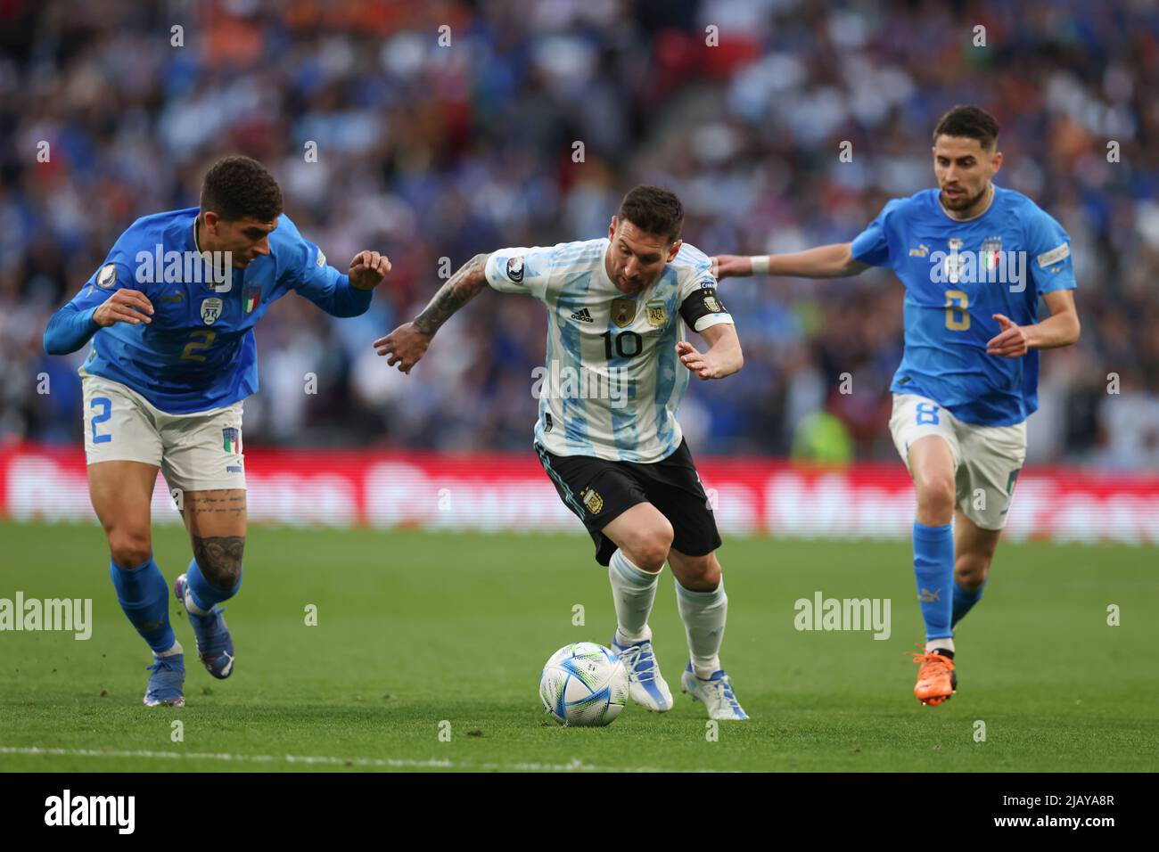 London, England, 1st June 2022. Lionel Messi of Argentina takes on Giovanni Di Lorenzo of Italy as Jorginho of Italy looks on during the CONMEBOL-UEFA Cup of Champions match at Wembley Stadium, London. Picture credit should read: Jonathan Moscrop / Sportimage Credit: Sportimage/Alamy Live News Credit: Sportimage/Alamy Live News Stock Photo