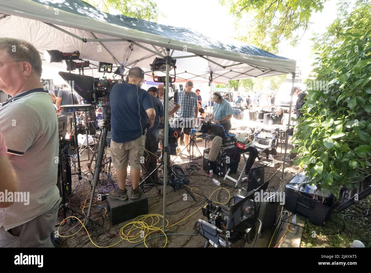 Uvalde Texas USA, May 25 2022: Members of the media gather outside Robb Elementary School to report on the story of an 18-year-old gunman's rampage at the school the day before. The shooter murdered 19 students and two teachers. ©Bob Daemmrich Stock Photo