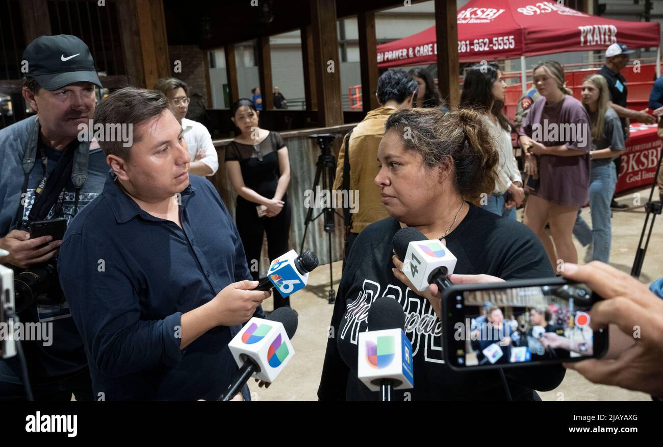Uvalde Texas USA, May 26 2022: Reporters interview a Robb Elementary fourth grade teacher during a community-wide service of healing after a lone gunman entered Robb Elementary School the day before and killed 21 people, including 19 children. ©Bob Daemmrich Stock Photo