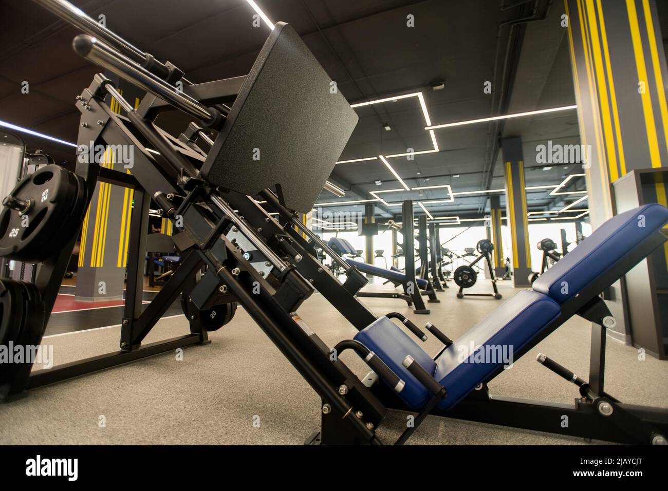 Big metal sports equipment with weights for bodybuilders is in health club Stock Photo
