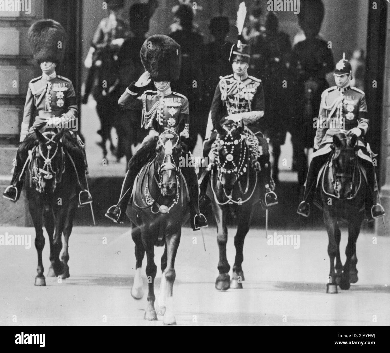 King Edward's First Trooping of the Colour Since His Accession: King Edward with his brothers, the Duke of York (left); the Duke of Gloucester and the Duke of Kent (right) riding from Buckingham Palace, London, S.W. today, to the trooping the Colour ceremony on the Horse Guards Parade, Whitehall, London, in celebration of his majesty's 42nd birthday. June 23, 1936. (Photo by The Topical Press Agency Ltd.). Stock Photo