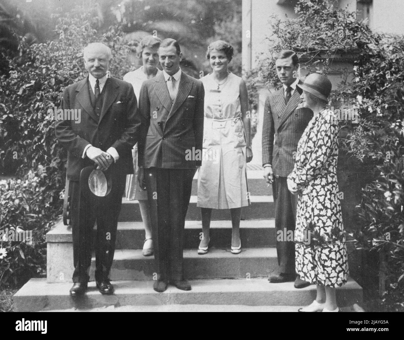 Wales Welcomed at Santiago: The Prince of Wales, Prince George at the British Embassy in Santiago, Chile. Left to right are: Ambassador Chinon, Prince George, Prince of Wales, Lady Chilton in rear, the Ambassador's two daughters. April 3, 1931. (Photo by Acme Photo). Stock Photo