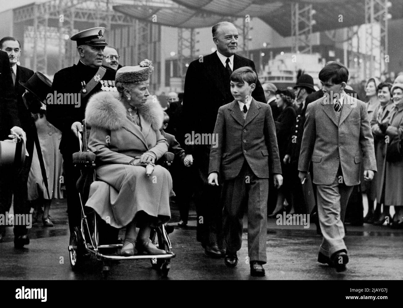 Royal Visit To South Bank Site -- Queen Mary chats with her grandchildren as she visits the Site in her wheel chair today. Prince Michael of Kent, Prince William of Gloucester. The King and Queen together with members of the Royal family today paid an official visit to the South bank Festival Site. May 5, 1951. (Photo by Fox Photos). Stock Photo