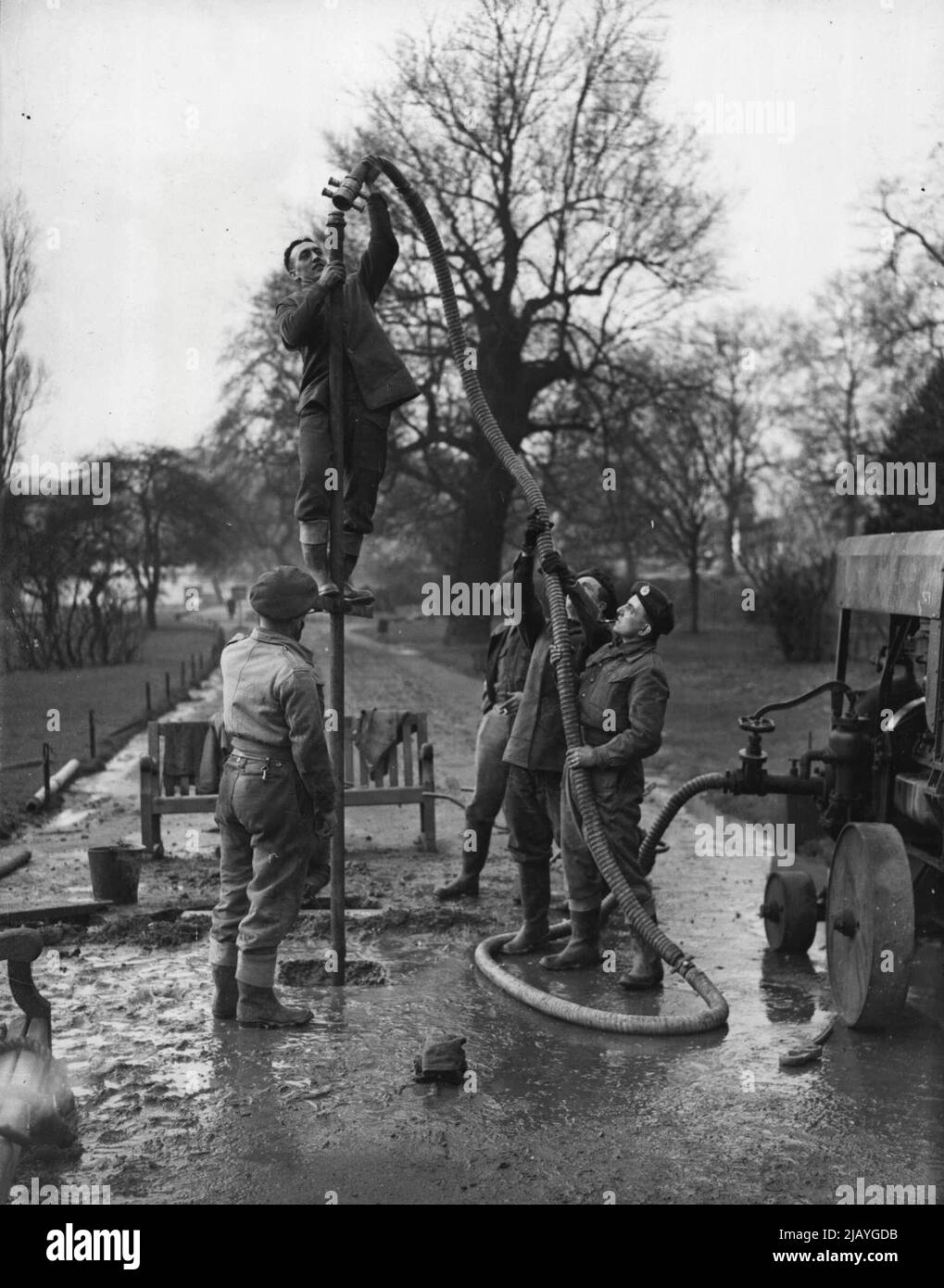 The Palace Bomb - Sappers commencing drilling operations to-day, Friday, on the suspected position of the nearest bomb to Buckingham Palace - some two hundred yards from the Palace gates. The mystery of the unknown St. Jame's Park 'Palace' bomb may soon be solved. Sappers are uncovering the 'solid object' located three days ago. February 01, 1946. (Photo by Reuterphoto). Stock Photo