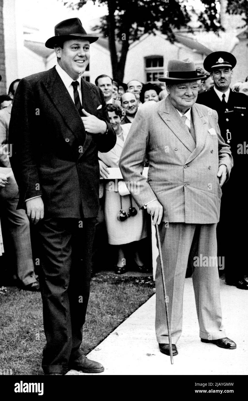 Sir Winston Churchill at the Race -- Sir Winston Churchill, with Captain Soamos, watches as his horse 'Pinnacle' is unsaddled after winning the Black & Decker plate at Windsor. Sir Winston Churchill visited Windsor, Race course,to watch his horse 'Pinnacle' run in the Black & Decker Plate. August 29, 1955. (Photo by Sport & General Press Agency, Limited) Stock Photo