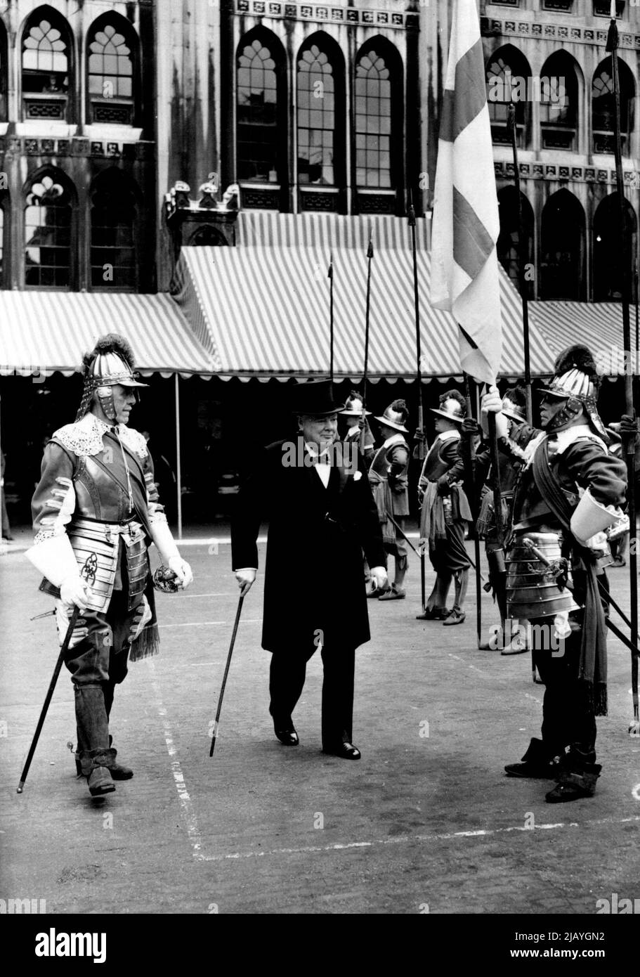 Sir Winston Seen His Statue Unveiled -- Sir Winston Churchill seen inspecting the poses of pikemen of the H.A.C., outside the Guildhall this morning. Sir Winston Churchill today saw a larger than life size bronze statue of himself unveiled at the Guildhall by the Lord Mayor of London Sir Seymour Howard. This statue, by Mr.Oscar Nemon shows Sir Kinston seated in an armchair Before this ceremony at which he made a speech, Sir Winston inspected a posse of Pikemen of the honorable Artillery Company. June 21, 1955. (Photo by Fox Photos). Stock Photo