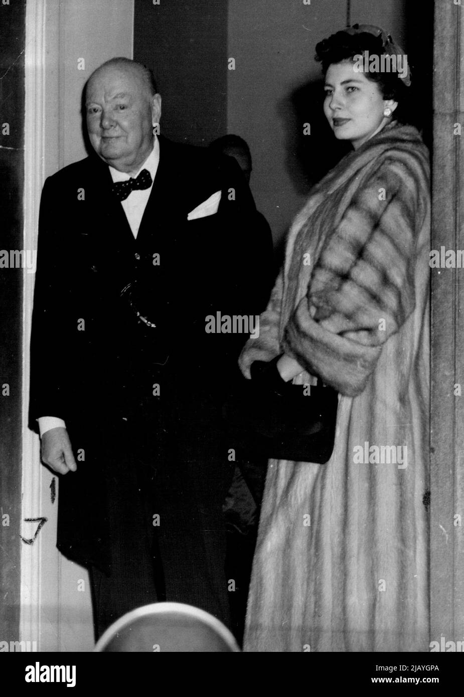 Doorstep Goodbye -- Sir Winston Churchill goes to the Door of No. 10 Downing Street this afternoon to say goodbye to his Guests, the Shah of Persia and Queen Soraya, who had been his guests to lunch. February 21, 1955. (Photo by Paul Popper, Paul Popper Ltd.). Stock Photo