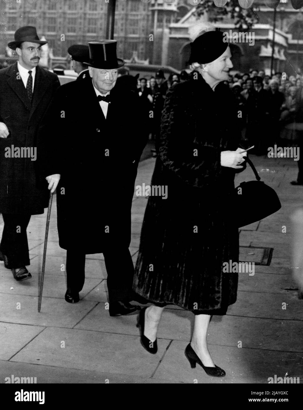 Churchill Arrive For 'Wedding of The Year': Mr. and Mrs. Winston Churchill, pictured here as they arrive at St. Margaret's, Westminster, London, for the wedding of the Marquis of Blandford and Miss Susan Hornby today (Friday). The 26-year-old ***** bridegroom, who is hair to the dukedom of Marlborough is a relative of Mr. Churchill. October 19, 1951. (Photo by Reuterphoto). Stock Photo