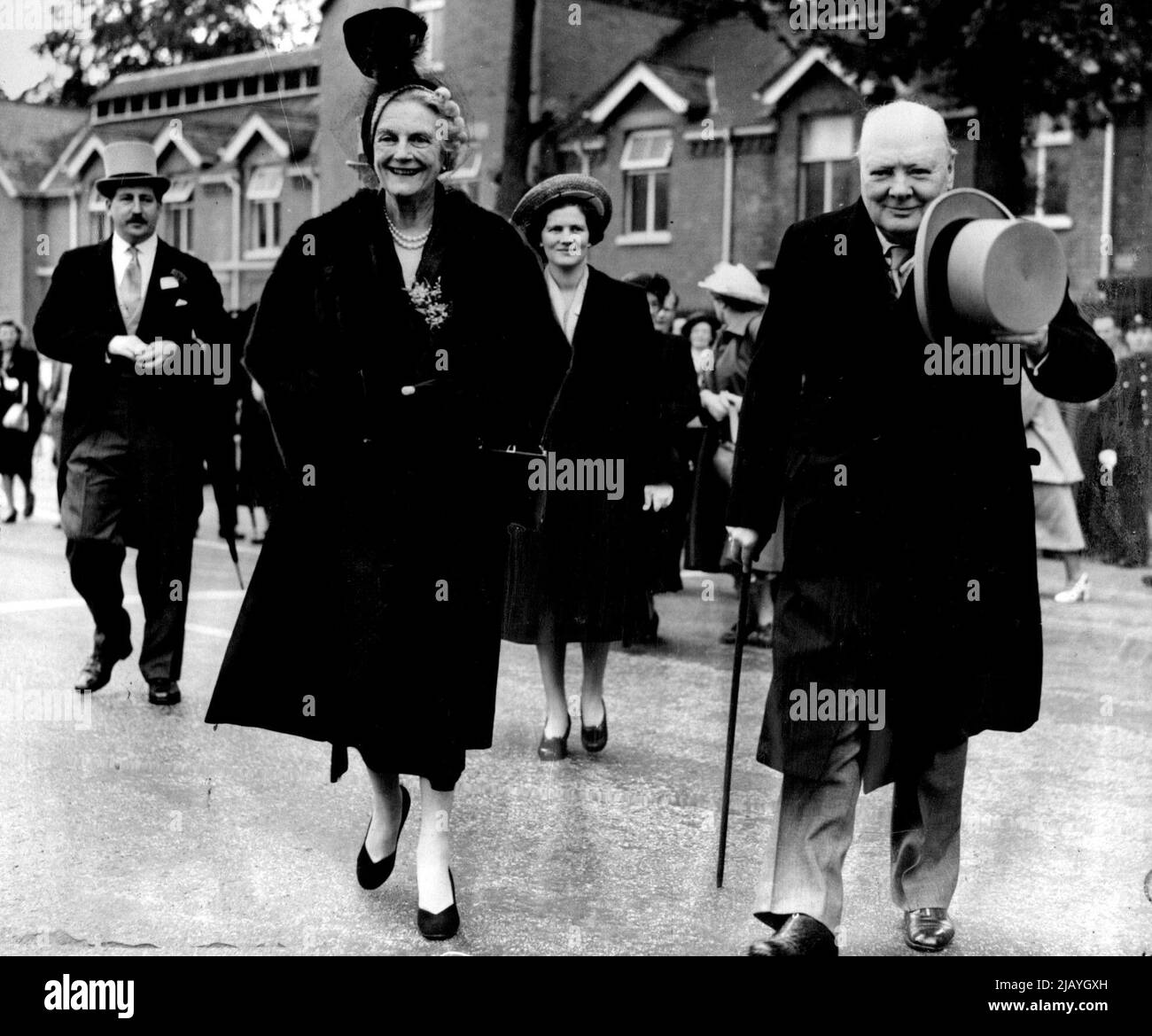 Churchill Carries On - Despite Car Crash On Way To Ascot: Mr. Winston Churchill, acknowledges cheers of the crowd and looks in good fettle, despite an incident on the way to the course, as he arrives with Mrs. Churchill at Ascot to watch his horse, Colonist run in the Gold Cup to-day (Thursday). Mr. Churchill's car ran into the back of an escorting police vehicle in Chiswick Highway, while on the way to the course. At Ascot, Mrs. Churchill said: 'It was nothing serious'. June 15, 1950. (Photo by Reuterphoto). Stock Photo