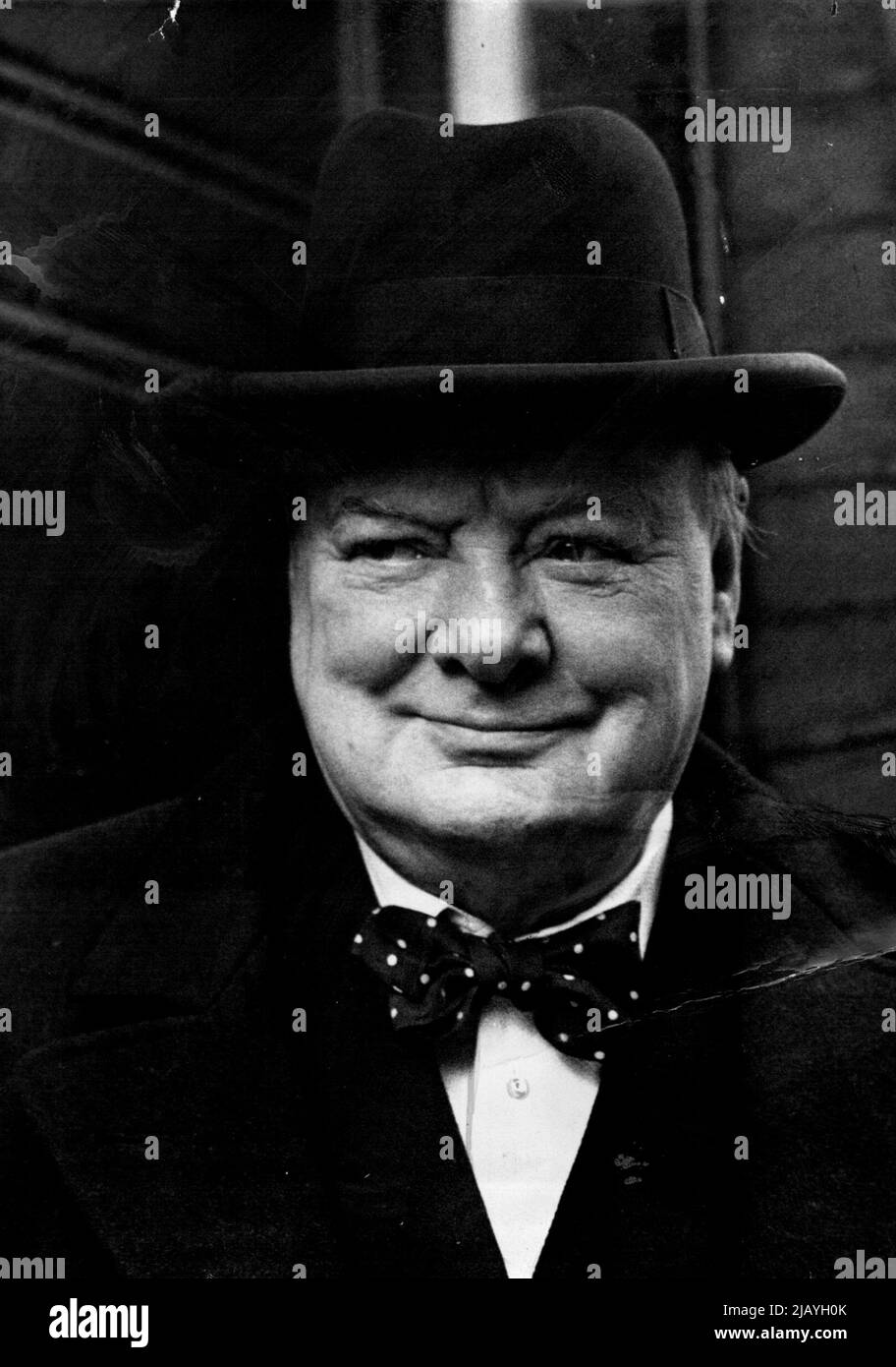 'Winner Election Day Smiles' Goes To Vote In Sth Kensington: Pictured as he leaves his Hyde Park Gate, London home to cast his personal vote, Mr. Winston Churchill wears a smile of confidence. Mr. Churchill who resides in the South Kensington constituency has Sir Patrick Spens as his Conservative candidate. February 23, 1950. (Photo by Fox Photos). Stock Photo