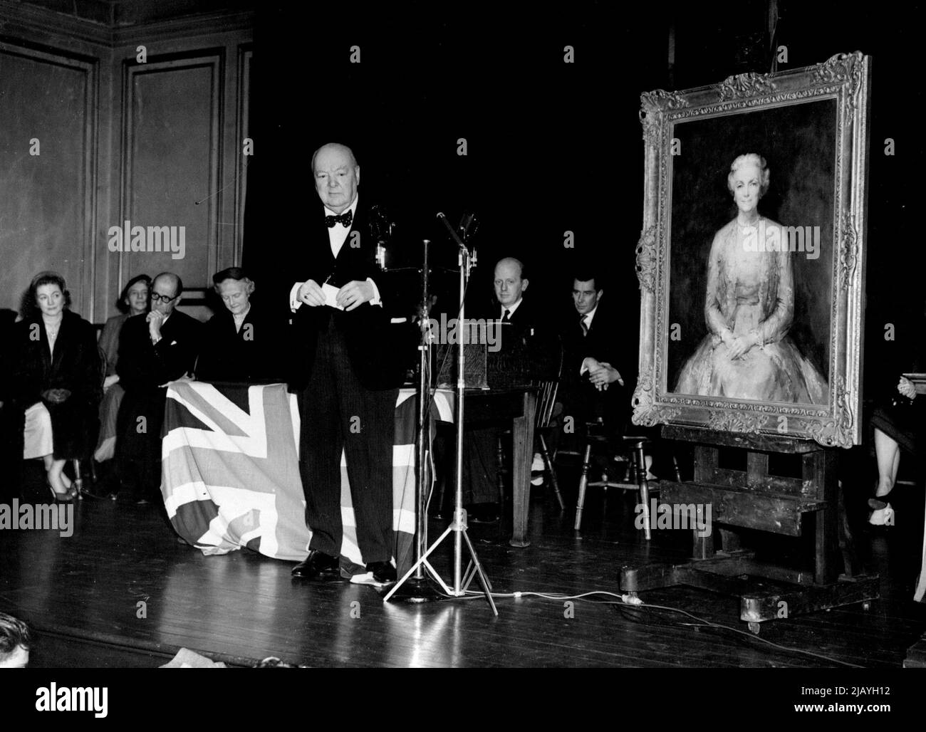 Presentation To Sir Winston Churchill: At the headquarters of the Woodford Conservatives Association to-night Sir Winston Churchill was presented with a portrait in oils of his wife Lady Churchill. It was for his 80th birthday which is on November 30th.....This picture shows him speaking at Woodford to-night after the presentation. November 23, 1954. (Photo by Daily Mail Contract Picture). Stock Photo