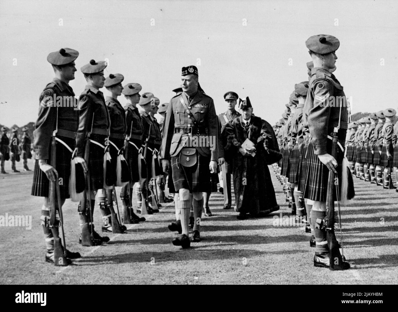 Freedom of City for Gordon Highlander -- The Duke of Gloucester the Gordon Highlanders at Harlaw Field, Aberdeen. H.R.H. The Duke of Gloucester, as Colonel-in-chief, accepted the Freedom of the City of Aberdeen on behalf of the Gordon Highlanders on Saturday. August 22, 1949. (Photo by Fox) Stock Photo