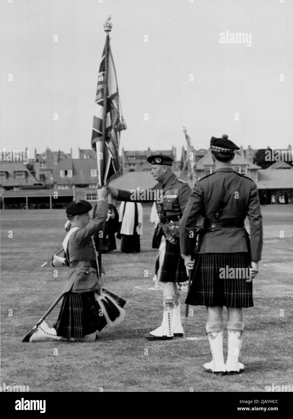 Duke of Gloucester Presents Colour to Gordon Highlanders -- H.R.H. The Duke of Gloucester seen presenting the colour of the Gordon Highlanders after the trooping Ceremony which took place at Harlow park, Aberdeen on Saturday August 20th 1955. September 8, 1955. Stock Photo