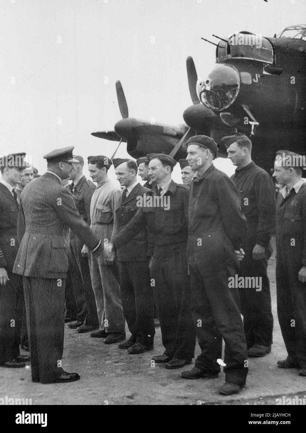 Duke Of Gloucester Visits Australian Bomber Squadron In Britain - The Duke of Gloucester, Governor-General designate of the Commonwealth of Australia, had special interest in the ground staff of a famous Australian Lancaster Squadron. In a visit to their station in England he chatted with the men about their homeland where he will soon take up his appointment. October 24, 1944. (Photo by Photographic News Agencies, Ltd.) Stock Photo