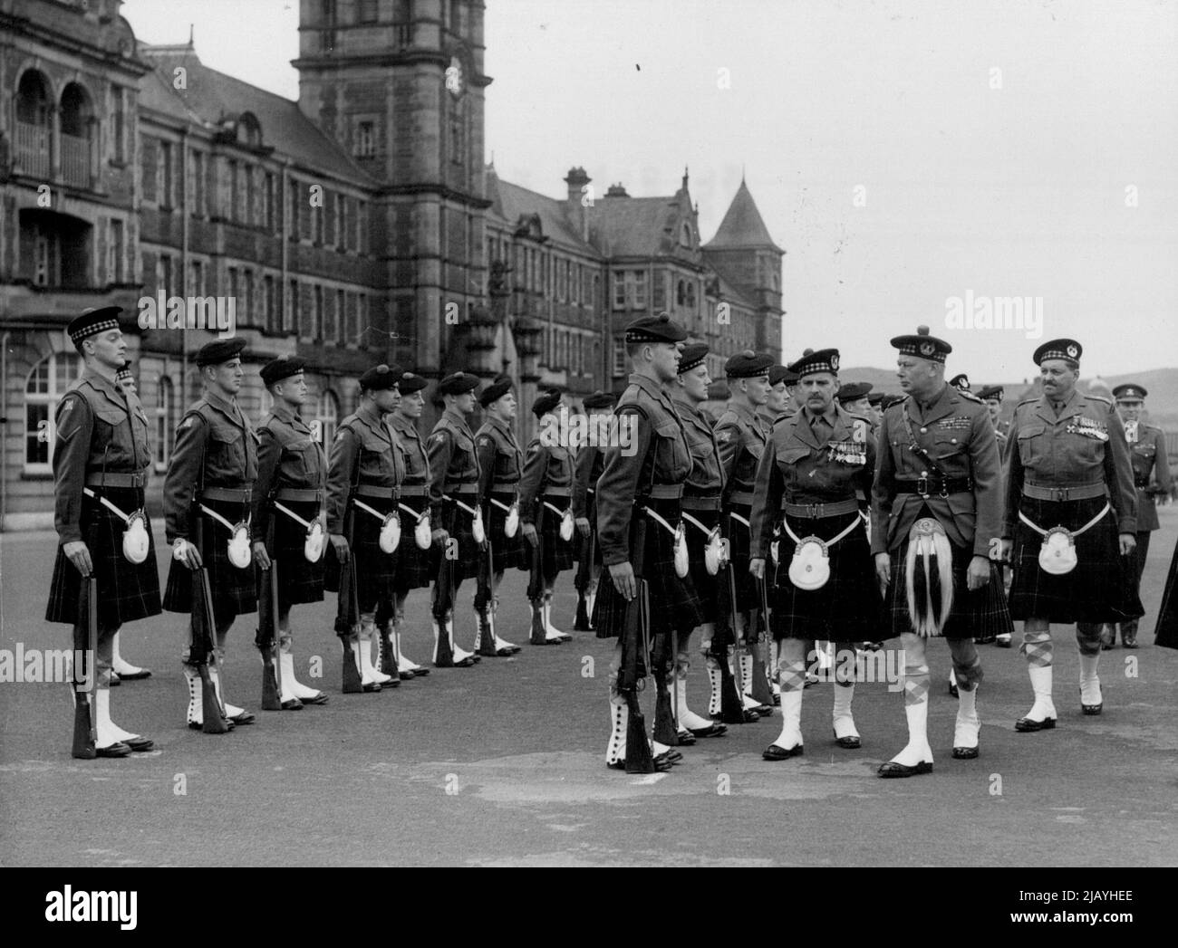 Duke of Gloucester Inspects Gordon Highlanders -- The Duke of Gloucester, accompanied by senior officers, inspecting the Gordon highlanders on the barrack square yesterday. The Duke of Gloucester, keeping a promise made to officers and men of the 1st. Battalion, the Gordon highlanders, when they arrived in this country in April after a three years Bandit hunting in Malaya, visited the Battalion at Redford Barraci Edinburgh, yesterday. To give their colonel-in-chief an insight into their campaigning in Malaya, the Gordons Demonstrated the weapons used in combating the terrorists, etc. June 25, Stock Photo