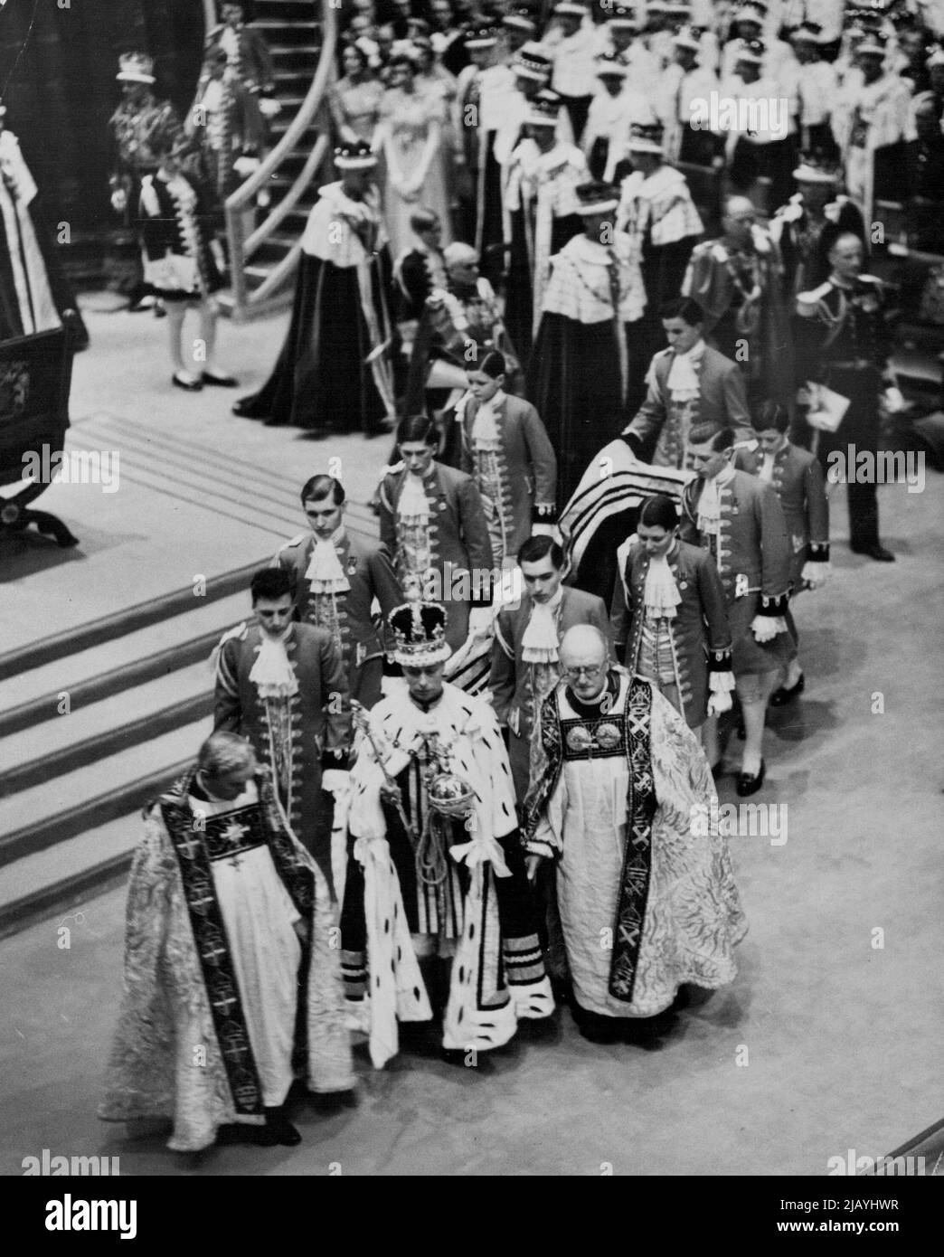 The Coronation Ceremony In Westminster Abbey -- The King carrying the Orb and Sceptre leaving the Abbey after the ceremony. May 12, 1937. (Photo by Sport & General Press Association Limited). Stock Photo