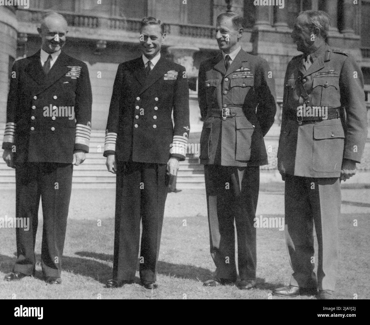 The King Receives Service Chiefs at Buckingham Palace: The King with Service Chiefs at Buckingham Palace. Left to Right: Admiral- of-the Fleet Sir Andrew Cunningham, First Sea Lord and Chief of the Naval Staff; His Majesty; Marshall of the R.A.F. Sir Charles Portal, Chief of the Air Staff; and Field Marshall Sir Alan Brooke, Chief of the Imperial General Staff. After opening the new Parliament his Majesty received Service Chiefs and Cabinet Ministers at Buckingham Palace. August 15, 1945. (Photo by Planet News Ltd.). Stock Photo