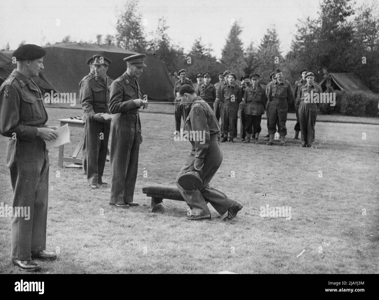 Investiture - His Majesty the King knighting Major General F.W. De Guingand, Chief of Staff to Field Marshal Montgomery with the K.C.B. January 14, 1945. (Photo by PNA). Stock Photo