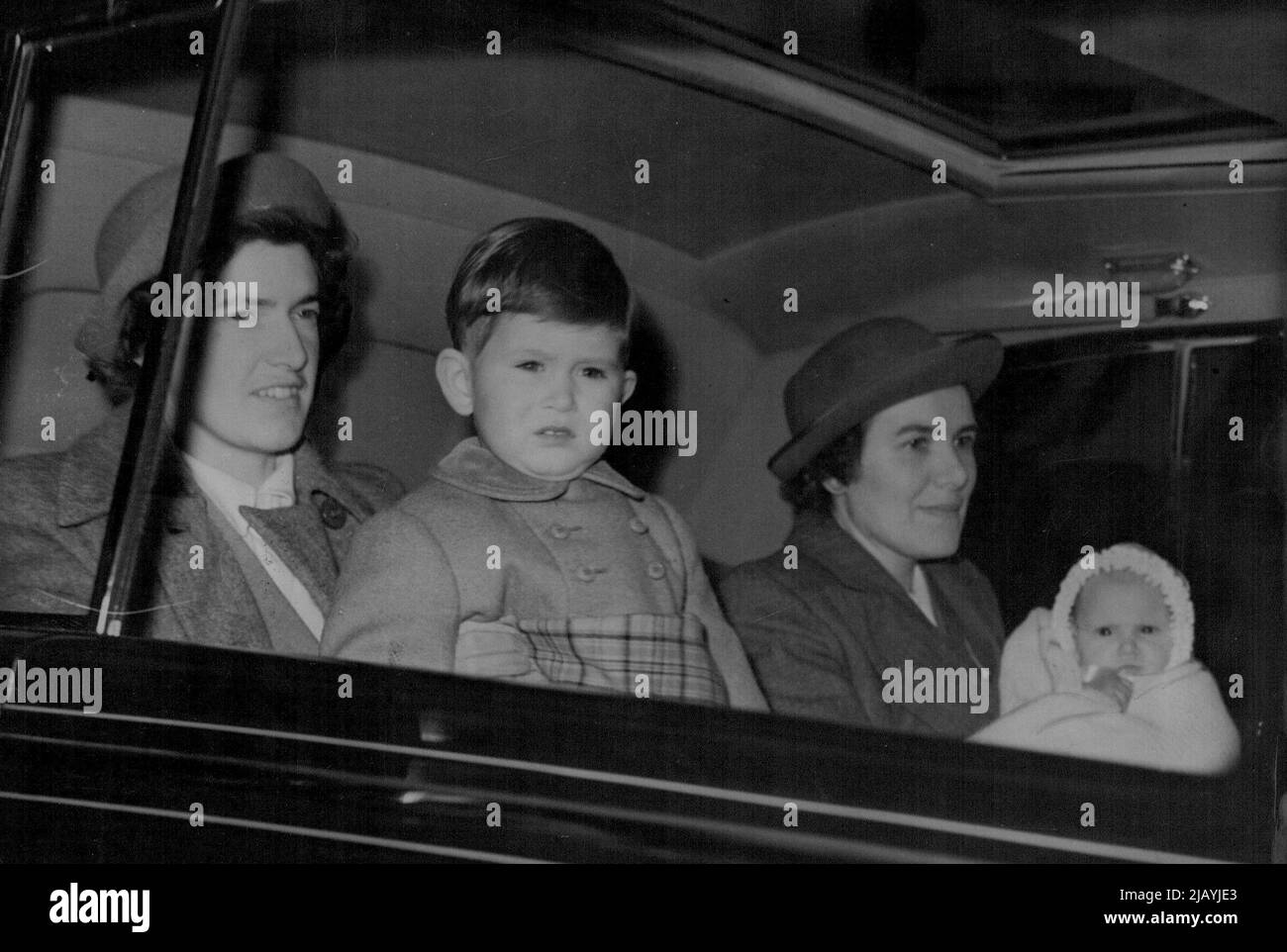 Baby Prince And Princess Go To Sandringham -- Princes Charles and his sister, Princess Anne - children of Princess Elizabeth and the Duke of Edinburgh - driving from Clarence House, London, to-day (Friday) en route to Sandringham where they will spend Christmas with the King and Queen. The baby Prince and Princess were understood to be going first to Buckingham Palace to join the King and Queen. December 22, 1950. (Photo by Reuterphoto). Stock Photo