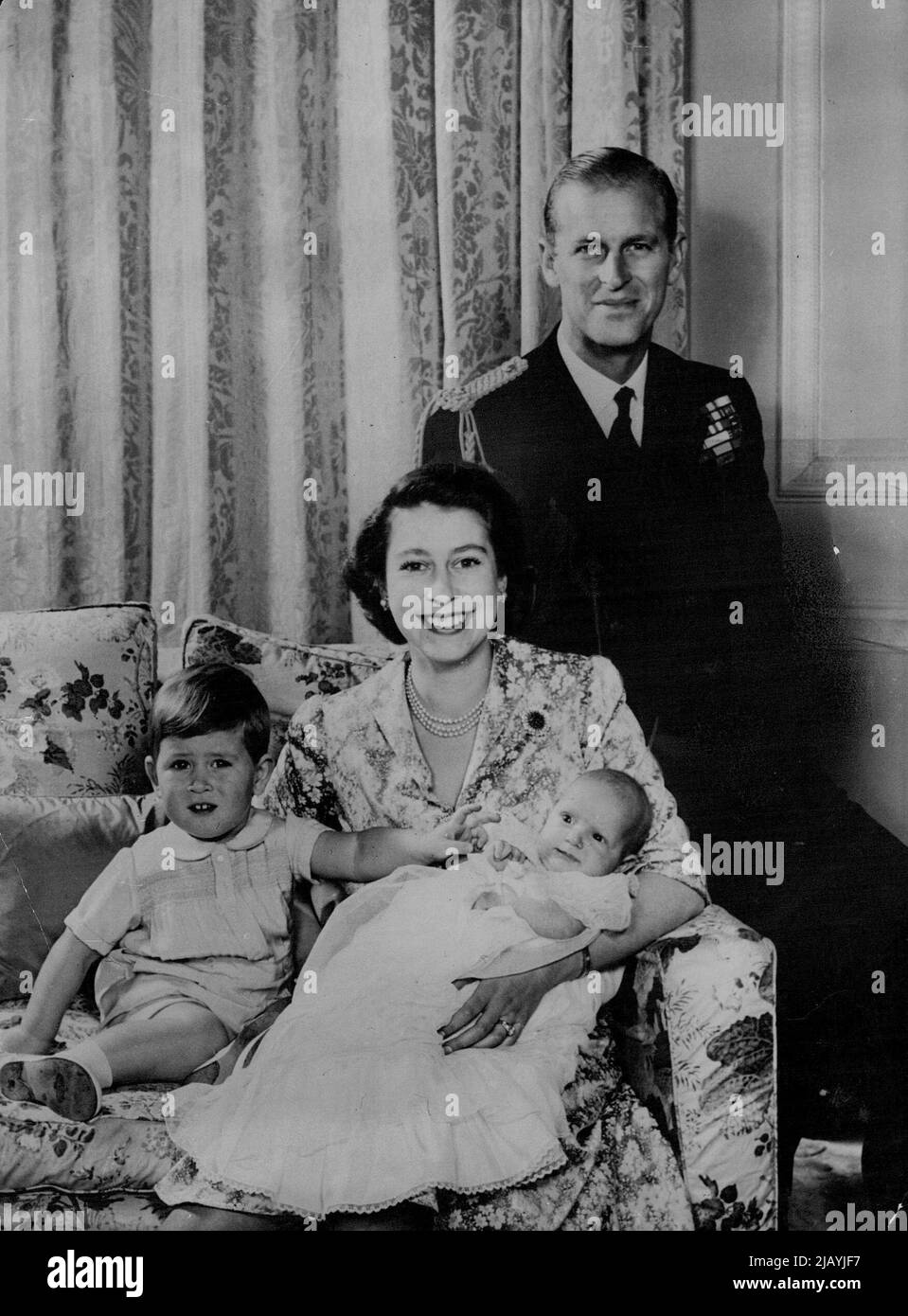 Princess's Family - New Picture -- This picture released today, Jan. 9, from Clarence House, London shows Princess Elizabeth, the duke of Edinburgh and their children, Prince Charles and Princess Anne, The Prince, who is reaching out to his baby sister, was born on 14 Nov. 1948: The little Princess will be five months old on 15 Jan. Princess Elizabeth, now in Malta, is expected back from Malta on Jan. 20. The Duke of Edinburgh commands the 1430-ton frigate magpie. January 30, 1951. (Photo by United Press Photo). Stock Photo