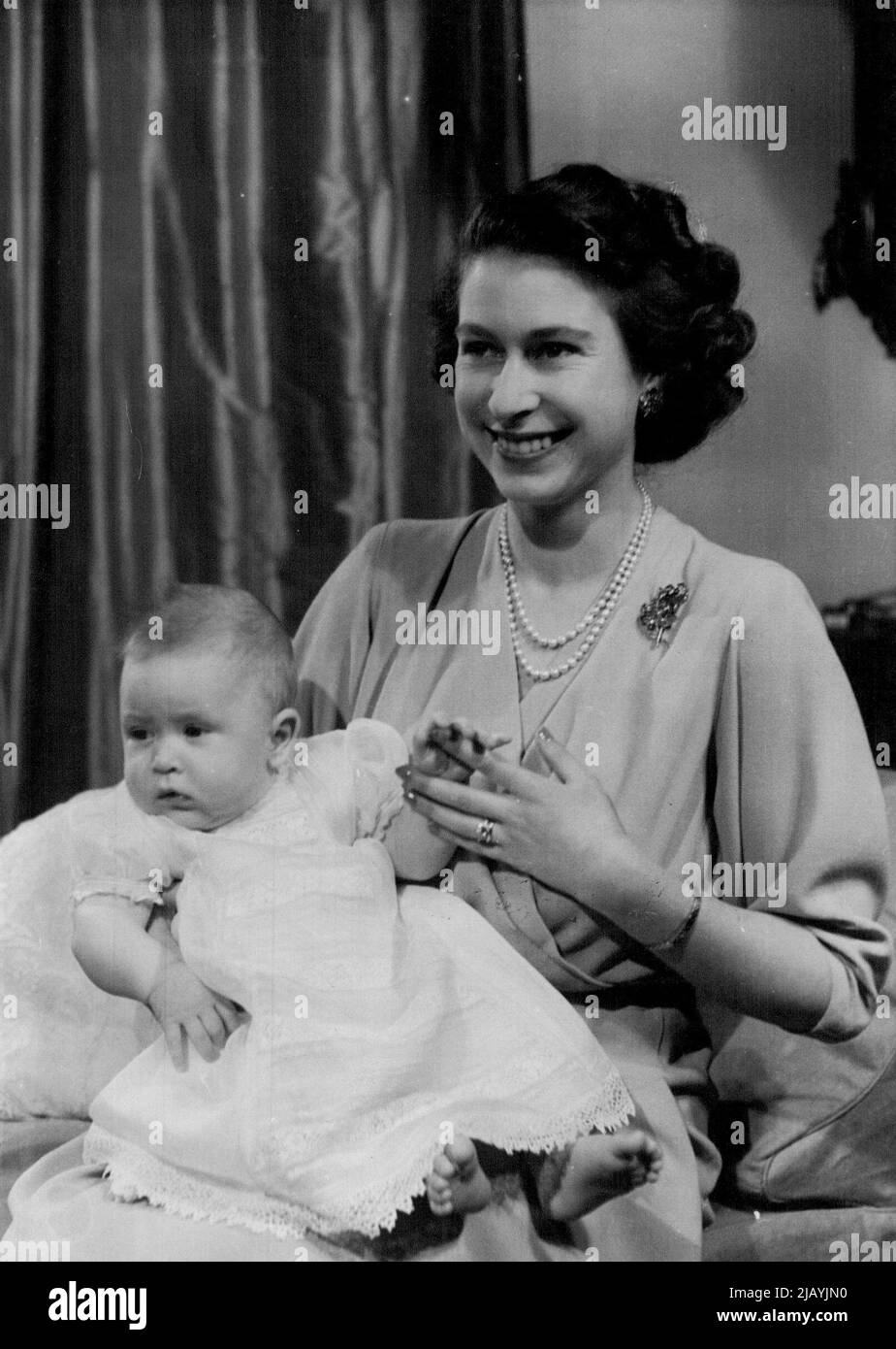 H.R.H. Princess Elizabeth And Prince Charles : Taken by Royal Command, picture shows H.R.H. Princess Elizabeth with Prince Charles in her private sitting room at Buckingham Palace. - Princess Elizabeth is dressed in dove-grey. Her Royal Highness will be 23 years of age on 21st April, 1949. April 9, 1949. (Photo by Baron, Camera Press). Stock Photo