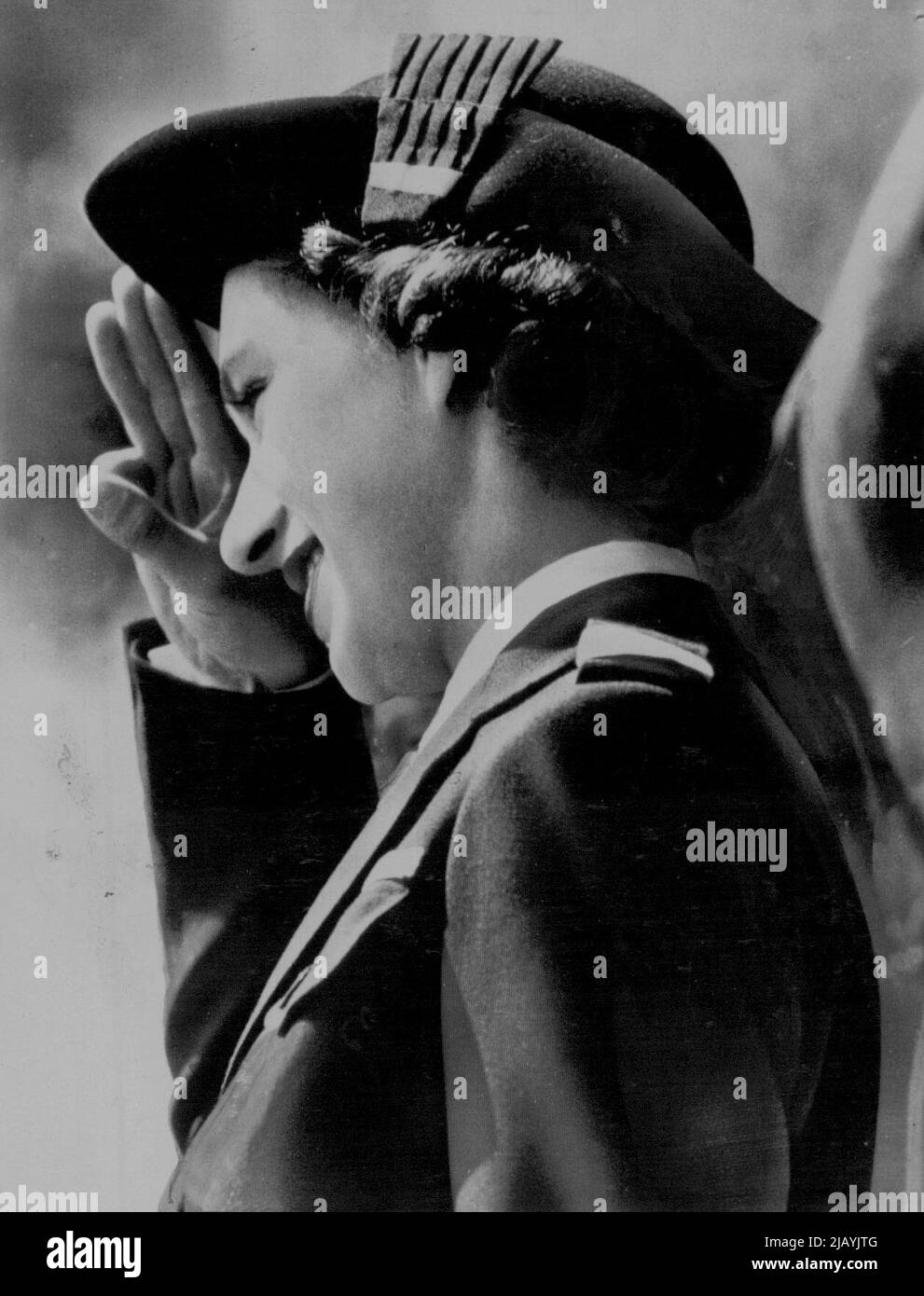 Commodore Margaret -- Princess Margaret, in the uniform of commodore of Britain's sea rangers, takes the salute during a review of 6000 Girl Guides at Chelmsford, Essex, England. June 27, 1949. (Photo by AP Wirephoto). Stock Photo