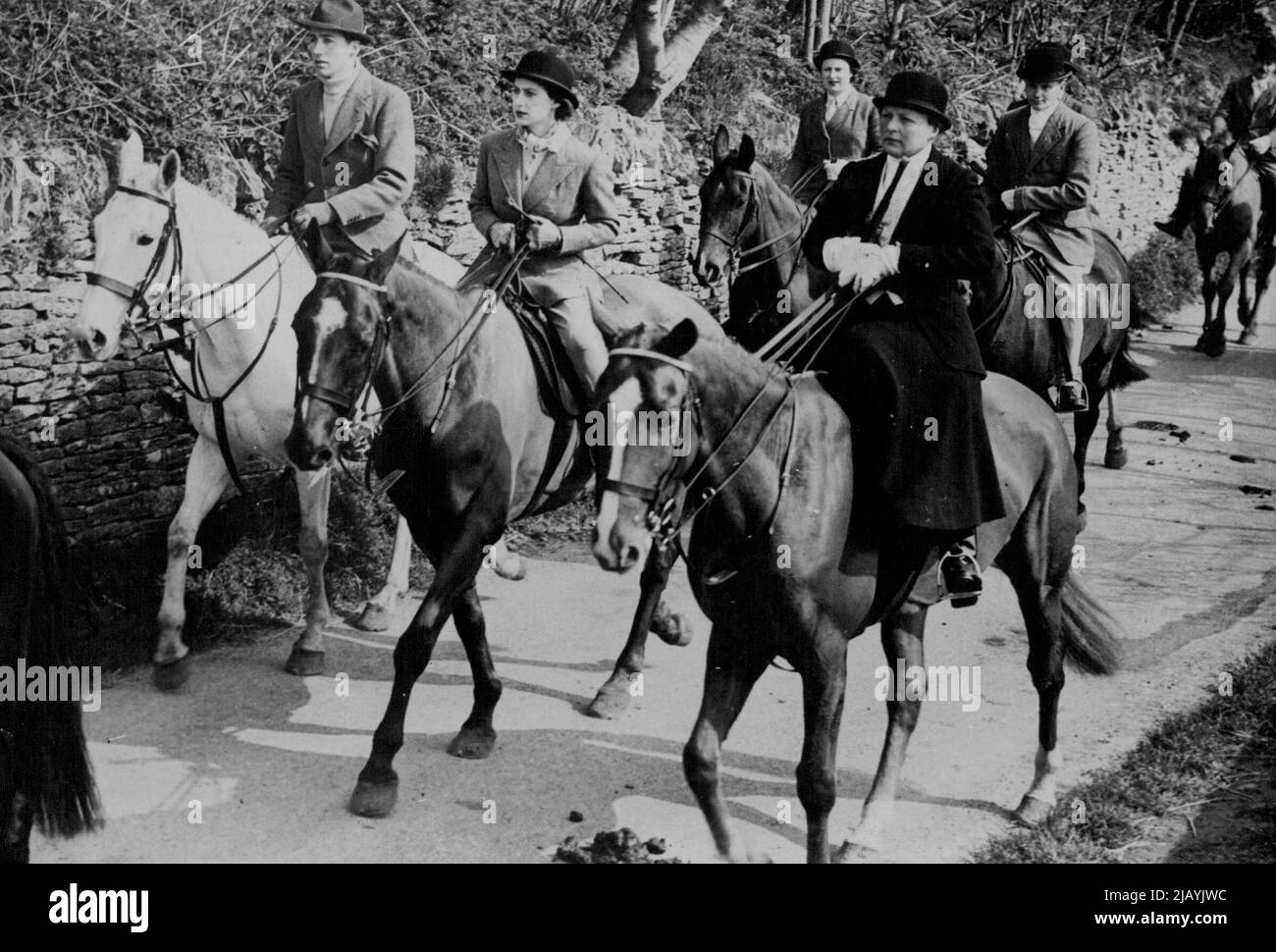 Princess Margaret Goes Hunting -- Princess Margaret, 18-year-old younger daughter of their Majesties King George and Queen Elizabeth, went out hunting it is believed for the first time when she attended the meet of the Duke of Beaufort's Hounds at Tresham, Gloucestershire. In this picture Princess Margaret (centre) is seen riding with the Duchess of Beaufort (right) at the meet. March 30, 1949. (Photo by Reuterphoto). Stock Photo