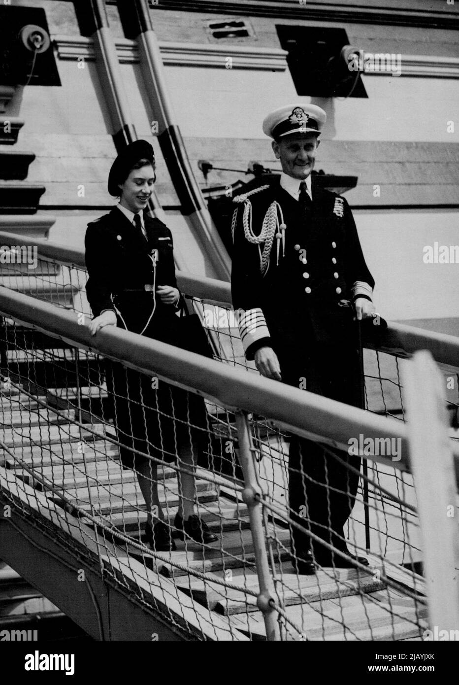 Sea Ranger Row The Princess -- Princess Margaret had a day with the Sea Rangers yesterday. As their Commodore, she went to Portsmouth to inspect 100 girls doing seamanship training aboard the training ship Foudroyant. Ships in the harbour were dressed overall as the Princess, in Sea Rangers' uniforms was rowed out to the 133-year-old man-o'-war in a boat manned by six Sea Rangers. She had tea in the ship. Later she visited Gosport and drove through the borough before returning to London by road. May 22, 1950. (Photo by Daily Mirror) Stock Photo