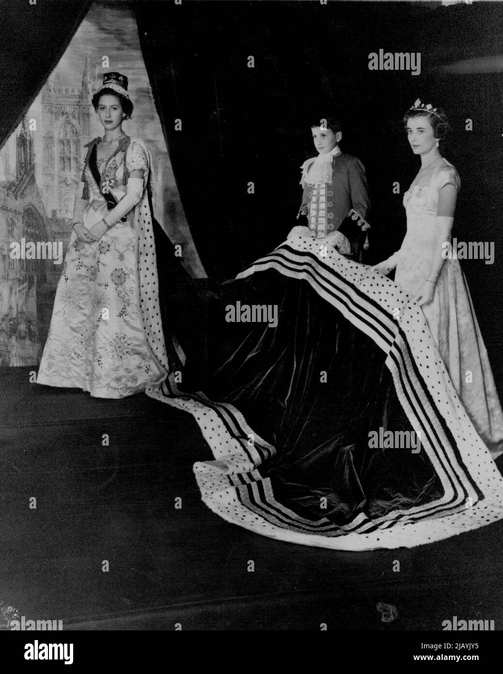 Princess Margaret -- Princess Margaret, wearing her coronation Robes, stands in the throne room at Buckingham Palace, London, for this picture make by Cecil Beaton ion coronation day, June 2nd, 1953. Her train is borne by Miss Iris Peake and by her Page Albemarle Bowes-Lyon, *****. Margaret in Coronation robes. August 6, 1954. (Photo by Associated Press Photo). Stock Photo