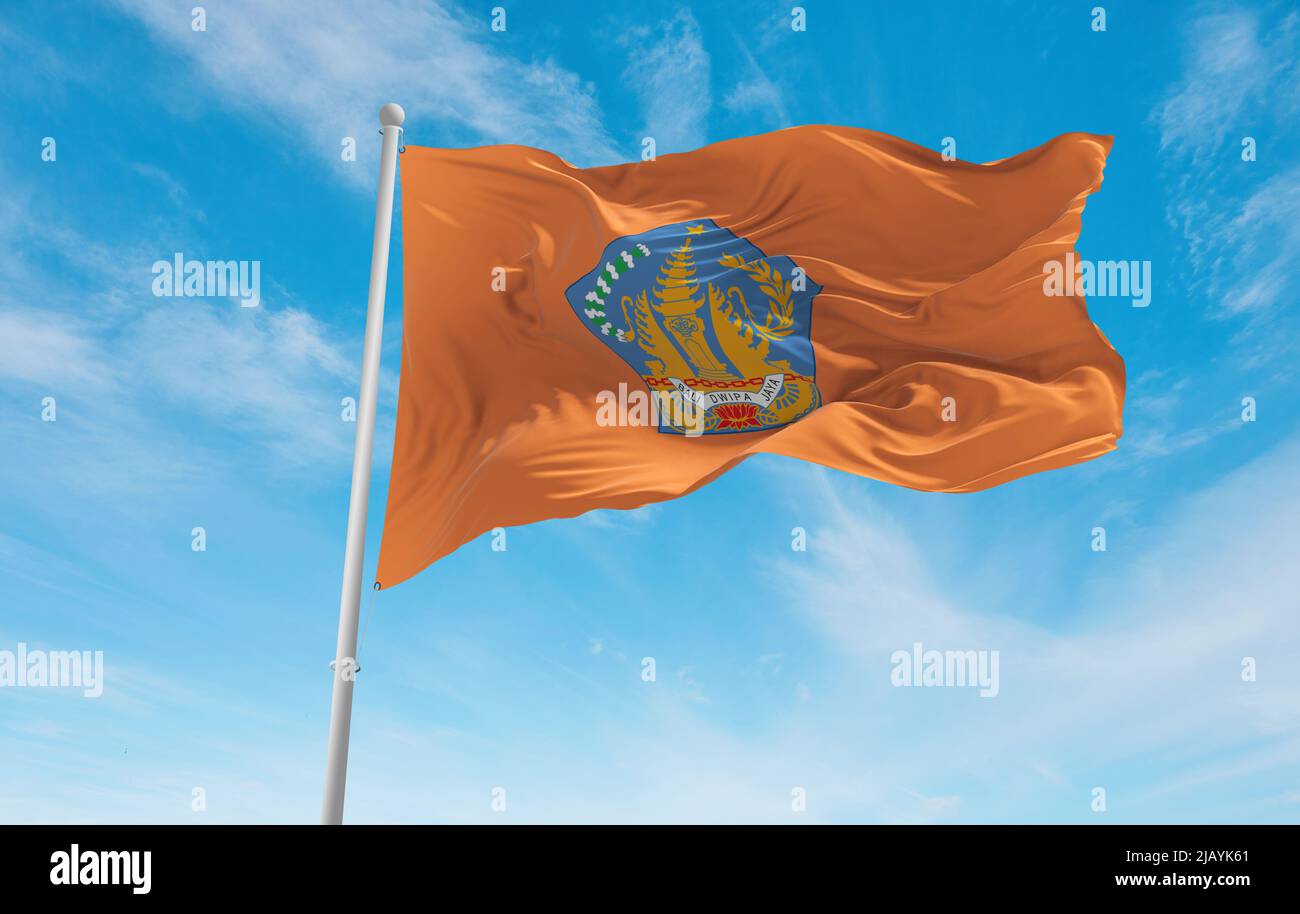 official flag of Bali Indonesia at cloudy sky background on sunset