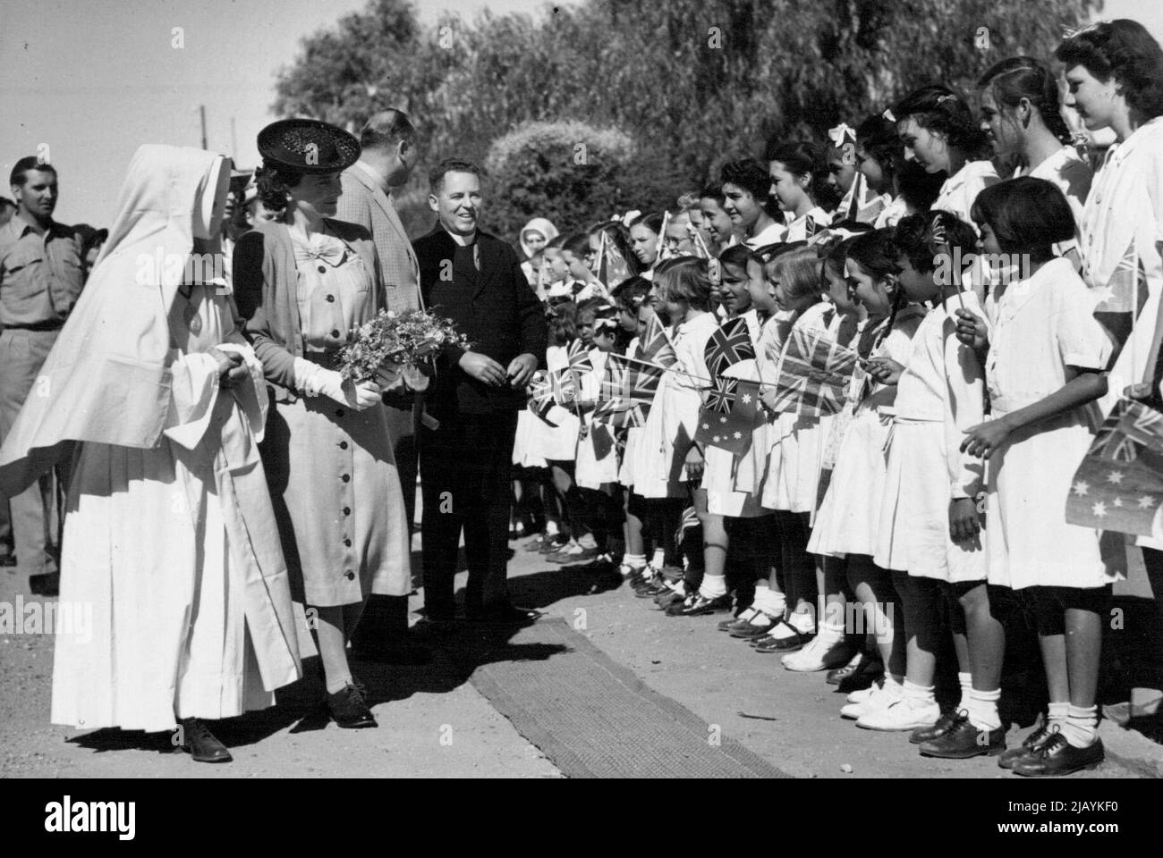 Duke Of Gloucester's Tour -- Their Royal Highness the Duke and Duchess of Gloucester meet school-children who gave then an enthusiastic welcome at Tennant Greek, which they visited recently on their tour. January 01, 1945. Stock Photo