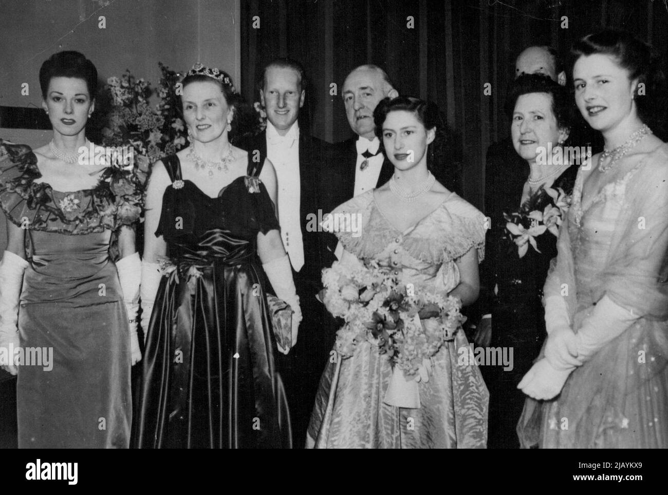 Princess Margaret's Week-End In Scotland -- The Buccleuch party at the Ball held in Glasgow in aid-of the Scottish Association of Girls' Clubs. Left to right: Miss Sheila Carlow, the Duchess of Buccleuch, the Earl of Dalkeith, 25-year-old only son of the Duke of Buccleuch, Sir Hector McNeill, Lord Provost of Glasgow, Princess Margaret, Lady McNeil, and Lady Caroline Scott, 21-year-old younger daughter of the Duke and Duchess of Buccleuch, one of Princess Margaret's great friends. Princess Margaret is week-ending in Scotland. She is staying with the Duke and Duchess of Buccleuch at Drumlanrig C Stock Photo