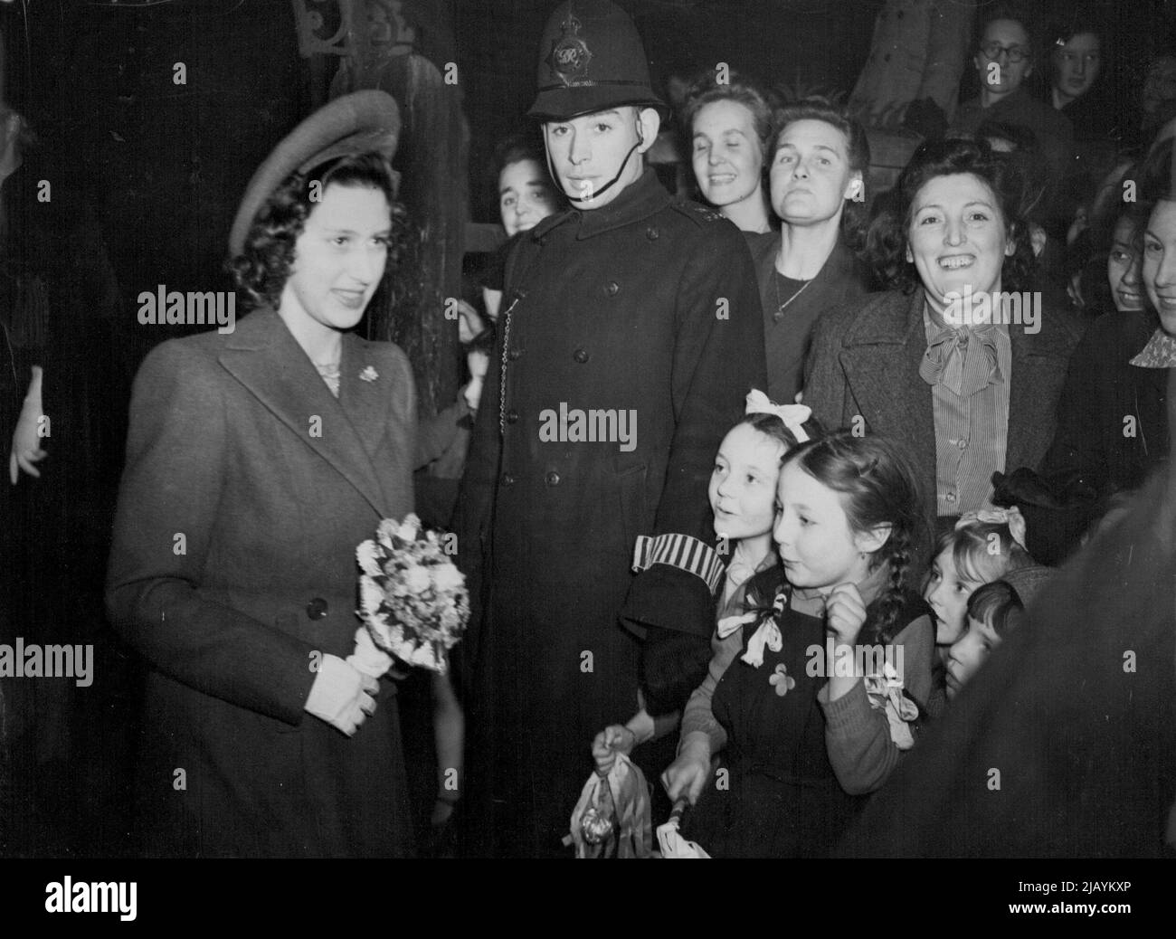 Princess Margaret Visits 'Camel Club Kids' -- Princess Margaret photographed as she left the 'Camel Club' this afternoon (Tuesday). Princess Margaret, fulfilling her first public engagement, went to Bethnal Green this afternoon (Tuesday) and met the 'Camel Club Kids'. The Camel Club - so named because it occupies the blitz-damaged 'Camel' public house - is run by University House under the children Fund. Here about a hundred Bethnal Green children meet nightly to sketch, play games, do cappentry and other hobbies. The Princess had previously this afternoon visited a similar club at the Hepscot Stock Photo