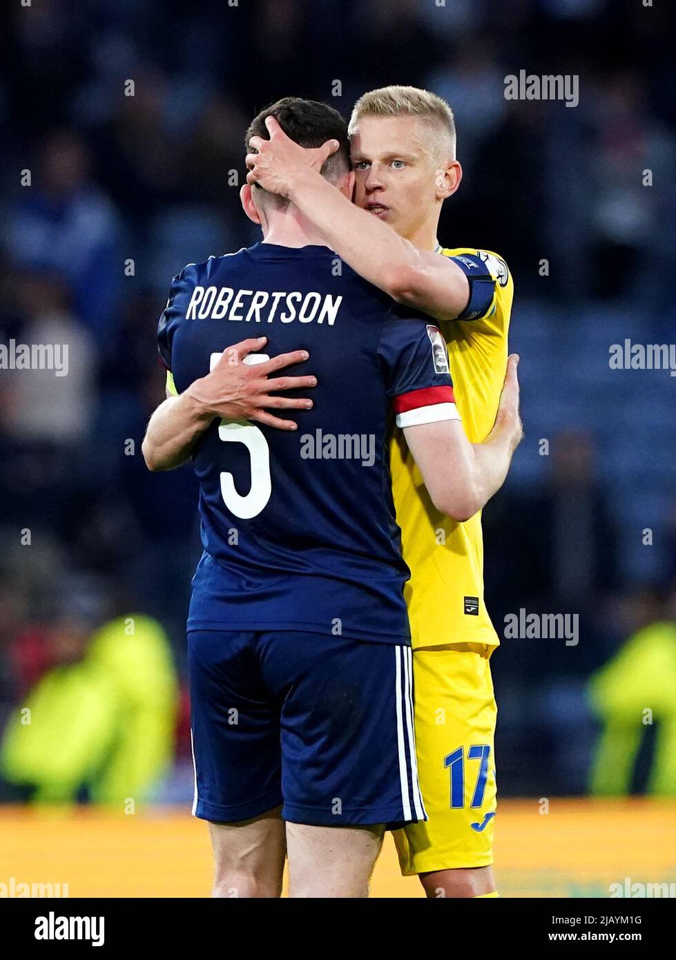 Scotland's Andrew Robertson (left) hugs Ukraine's Oleksandr Zinchenko