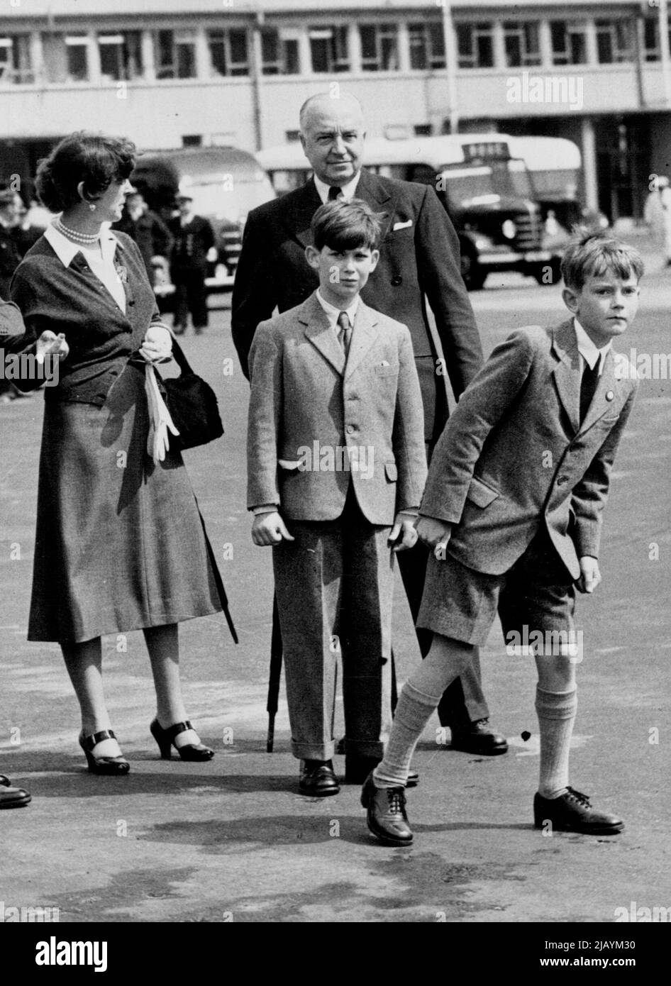 The Duke Of Edinburge Flies Through From Helsinki To Cowes -- The Duchess of Kent, wearing woollen cardigan, and no hat, waits with her son, Prince Michael and a little friend for the arrival of the Comet which brought the Duke of Edinburgh and her elder son, the Duke of Kent. HRH the Duke of Edinburgh arrived back from Helsinki by comet jet air liner this morning. At London, and from there went to Cowes to compete in the racing in his yacht, Coweslip. August 05, 1952. (Photo by Fox Photos). Stock Photo